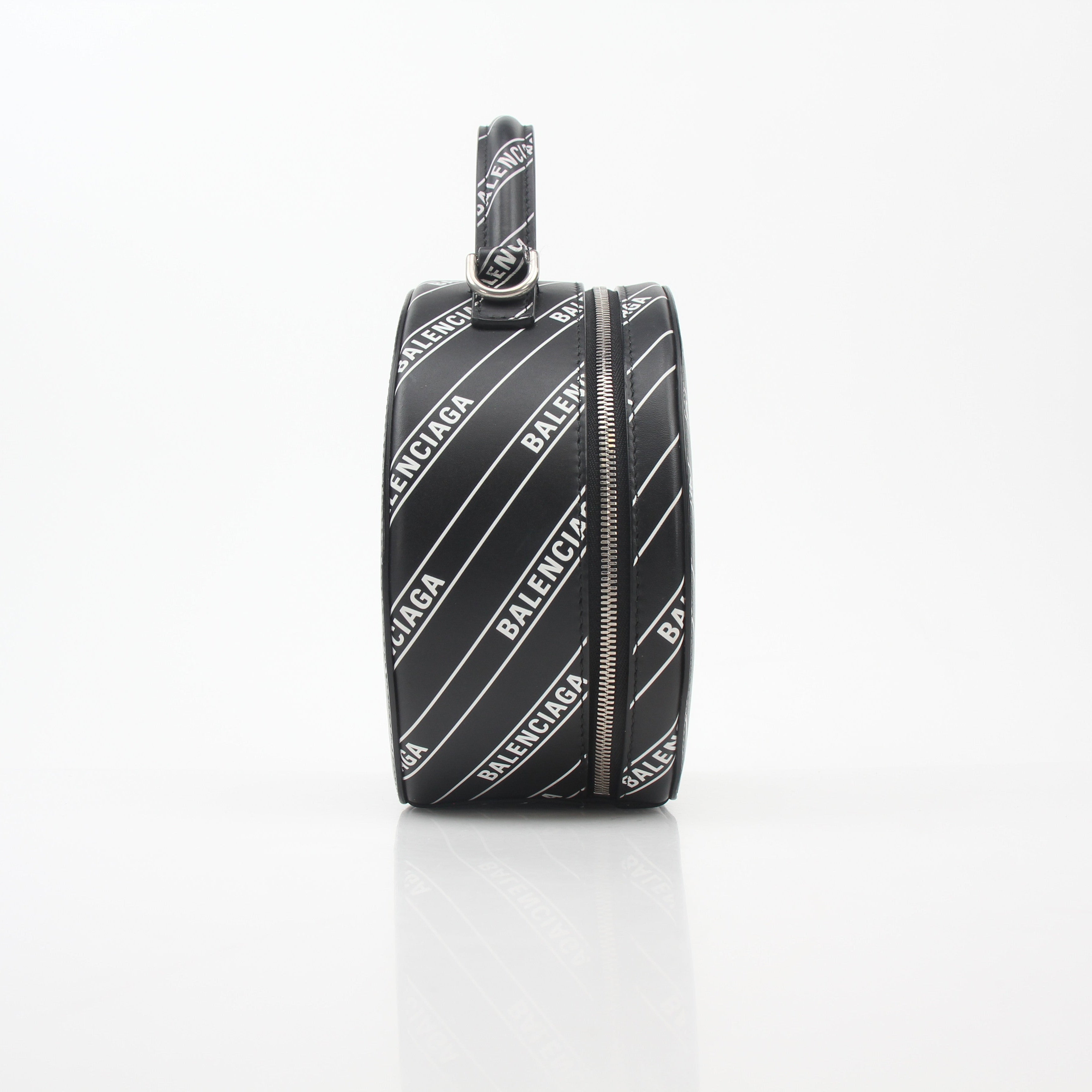 Black Balenciaga logo XS Vanity round handbag with gold accents, compact and stylish for everyday use.
