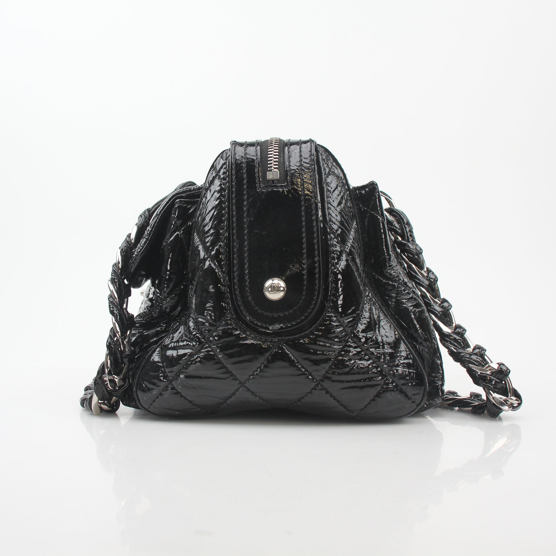 Gold & Beyond black quilted patent handbag with glossy flap and gold-tone chain strap, classic Chanel-inspired design.
