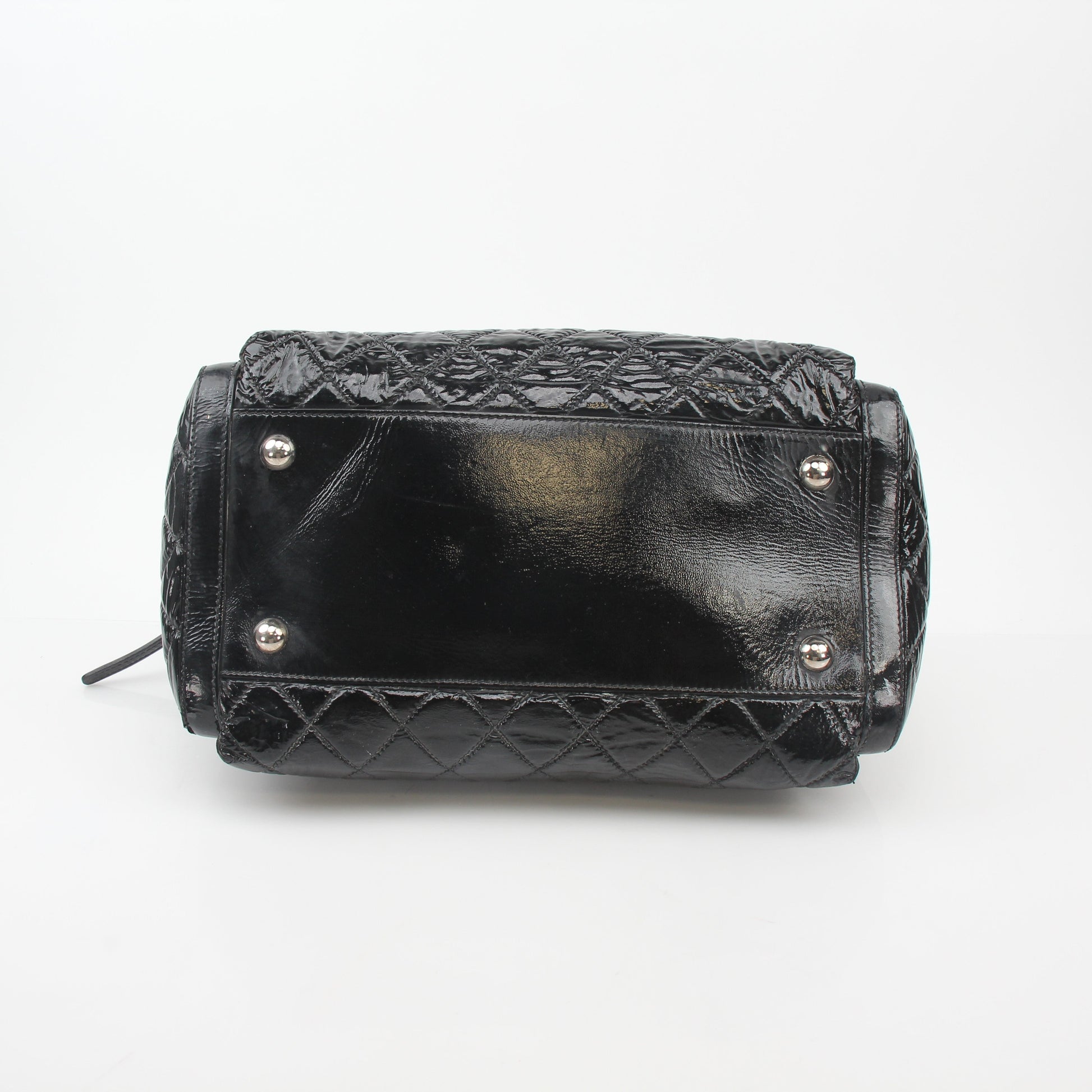 Gold & Beyond black quilted patent handbag with glossy flap and gold chain strap, stylish and elegant accessory.