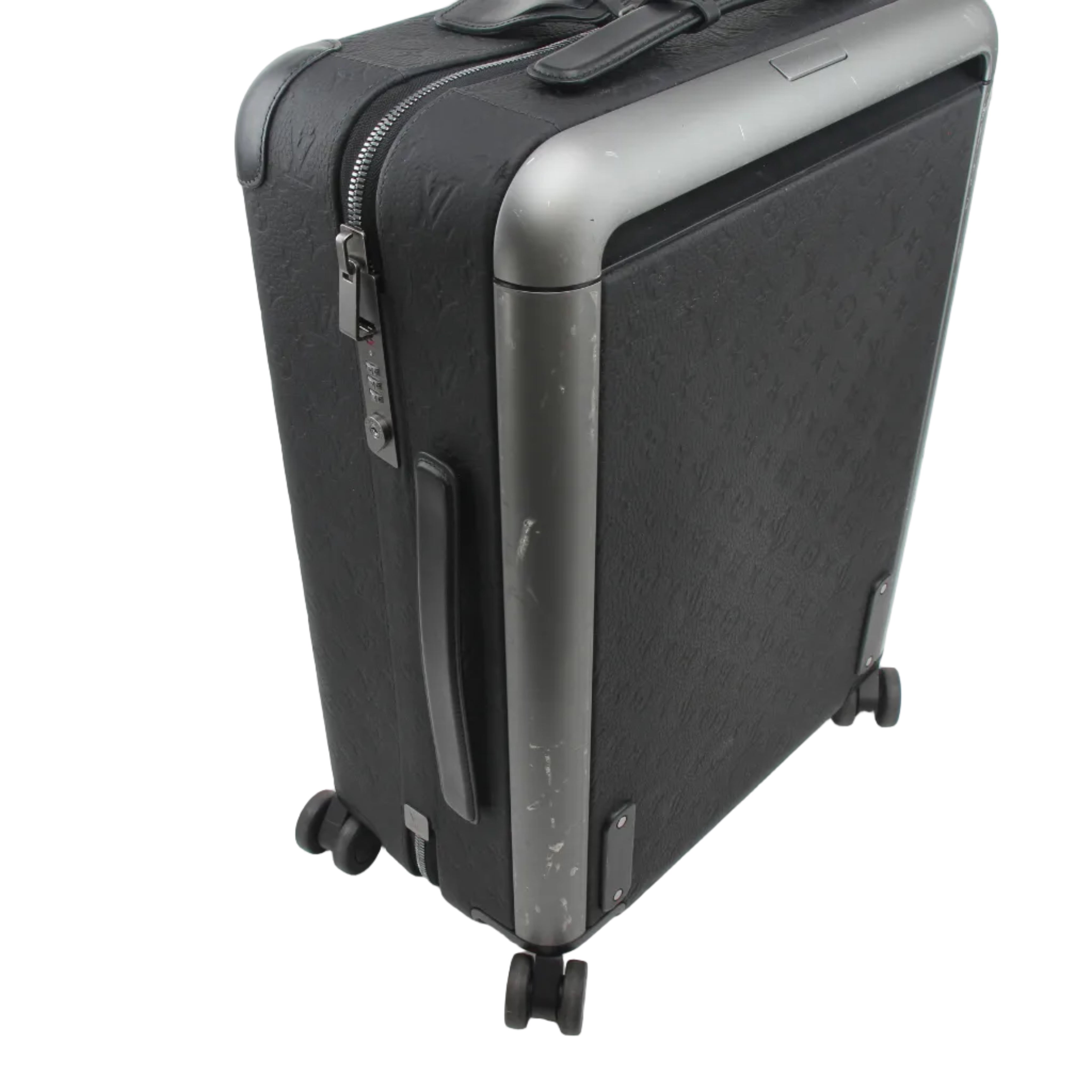 Louis Vuitton Black Horizon 55 Taurillon Monogram rolling luggage with four wheels and extendable handle, designed for travel.
