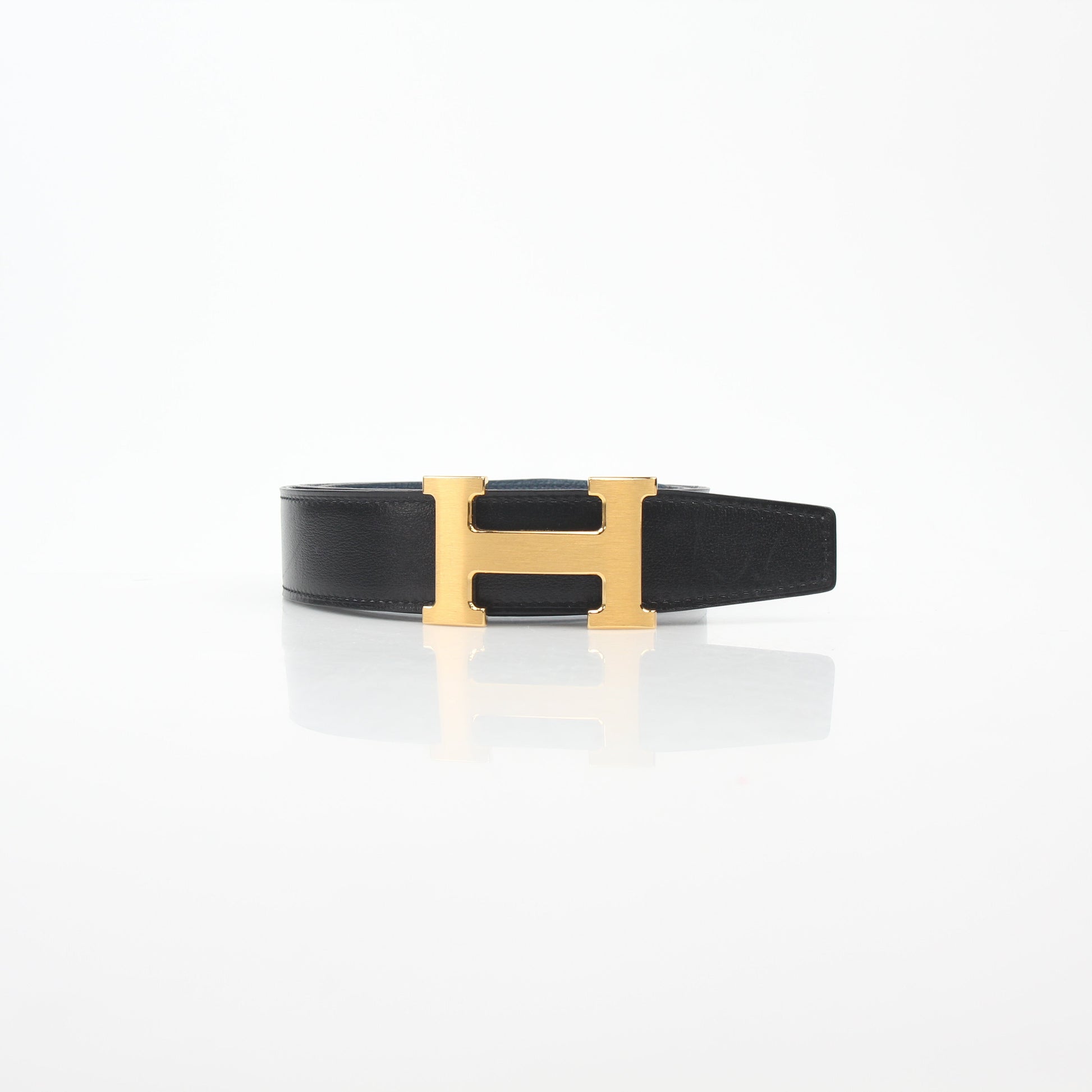 Hermès black and blue reversible belt kit with H buckle by Gold & Beyond, showcasing versatile accessories for stylish outfits.