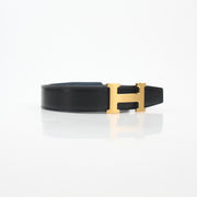 Hermès black and blue reversible belt kit with H buckle, designed for accessories and high-end fashion.