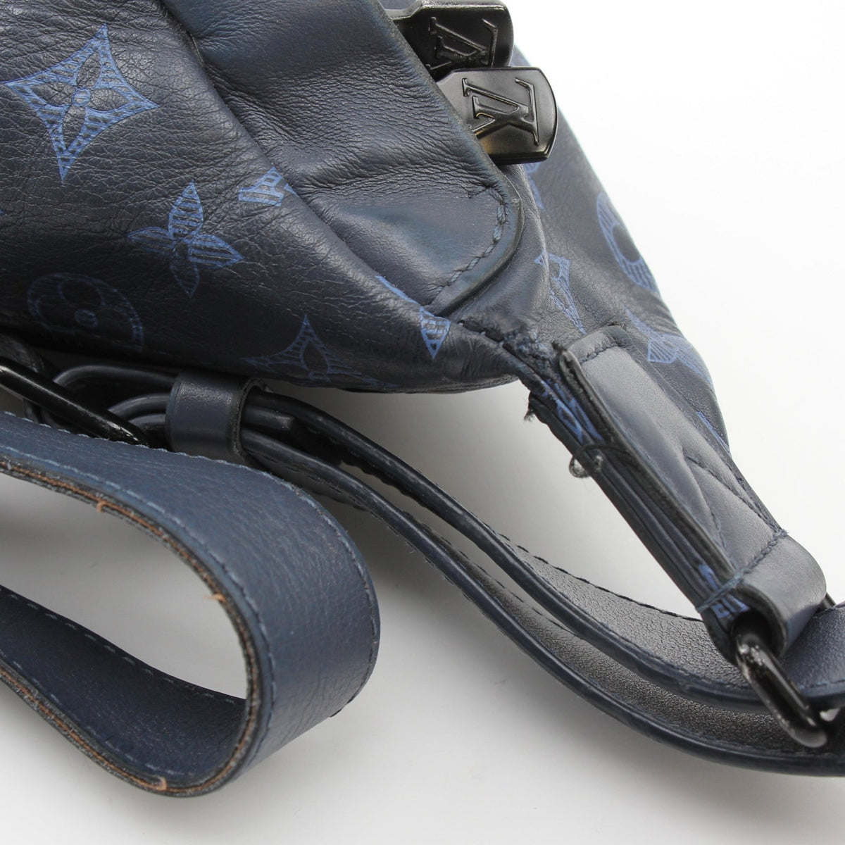 Louis Vuitton Blue Monogram Shadow Discovery Bumbag handbag with adjustable strap and gold hardware, styled for casual wear.
