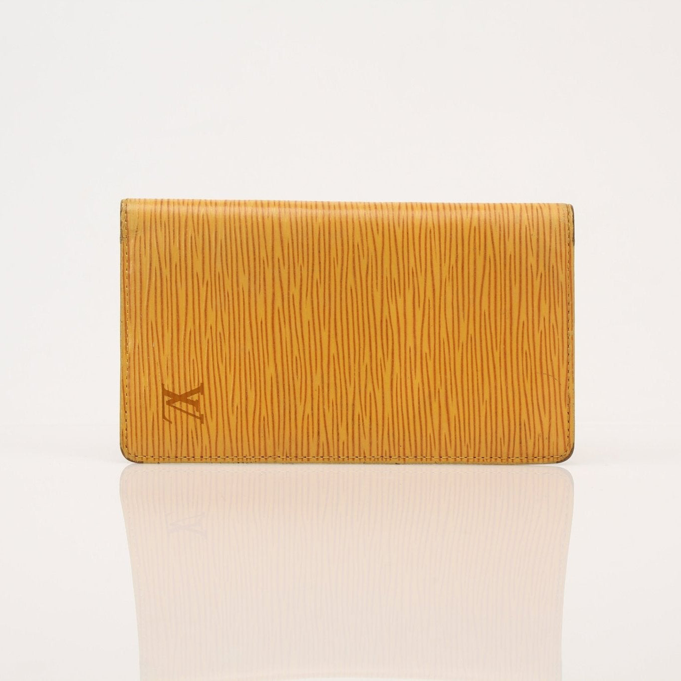 Louis Vuitton Epi yellow wallet by Gold & Beyond, showcasing textured leather and sleek design with multiple card slots.