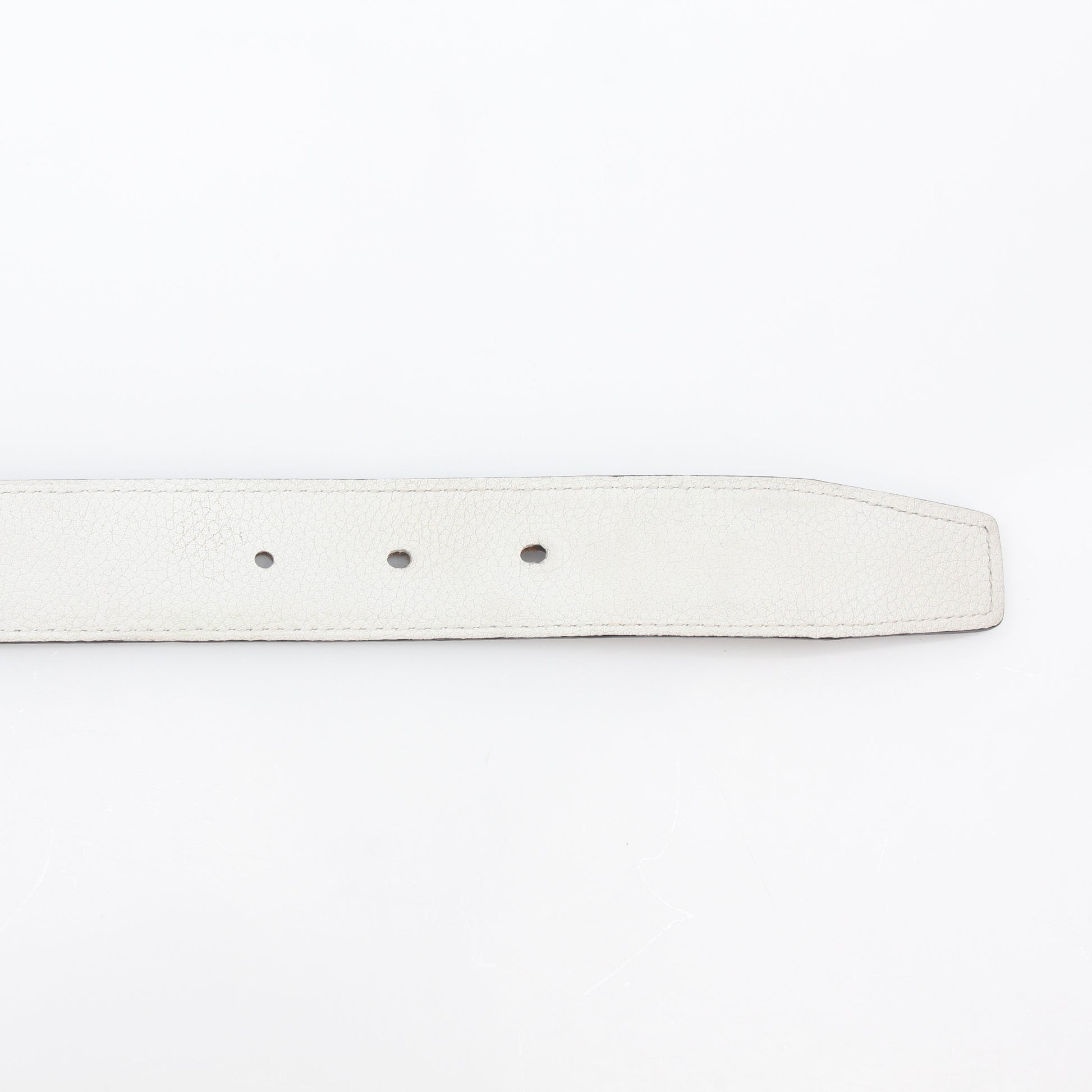 Hermès white and Etoupe reversible leather belt strap for accessories, showcasing the reversible design and quality craftsmanship.