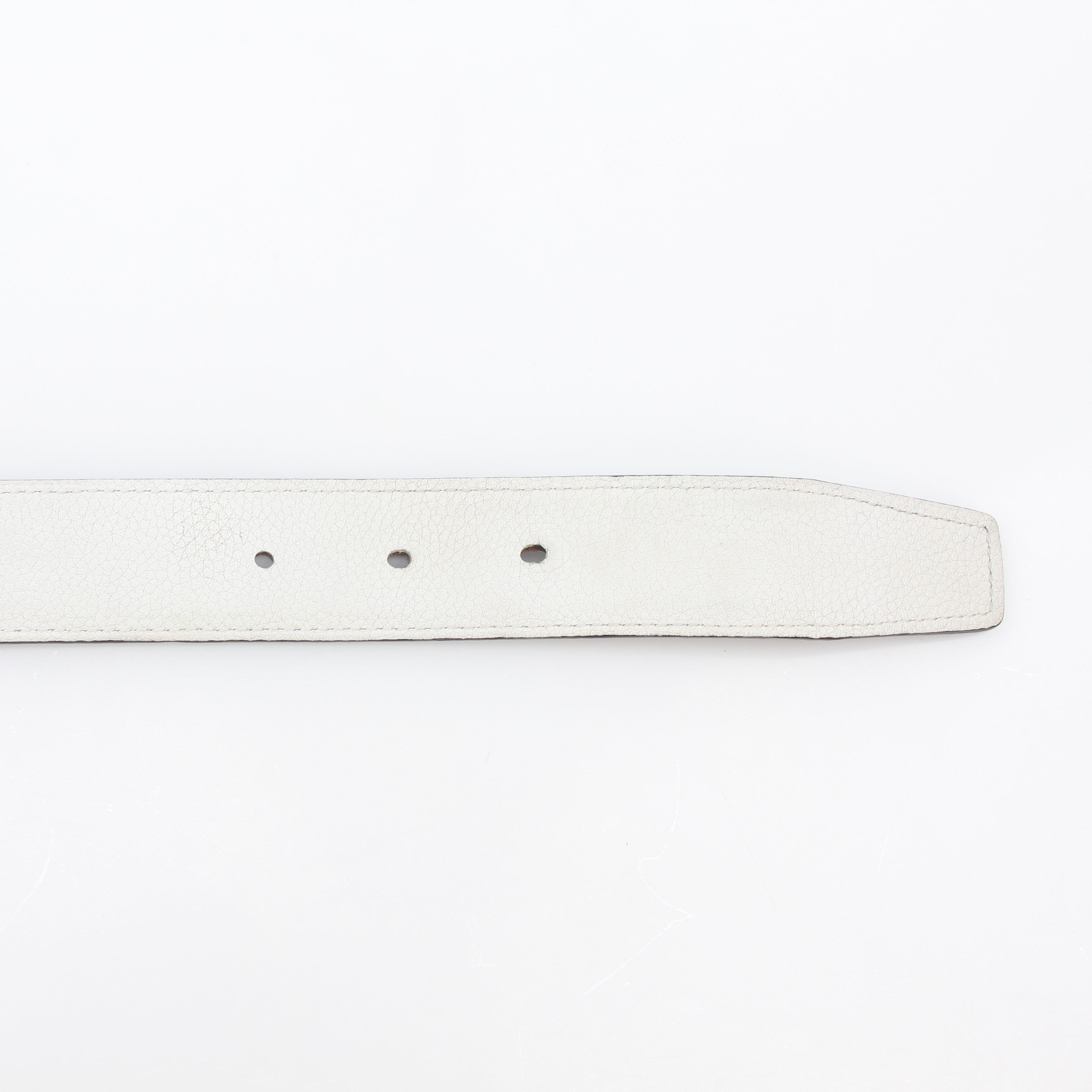Hermès white and Etoupe reversible leather belt strap for accessories, showcasing the reversible design and quality craftsmanship.