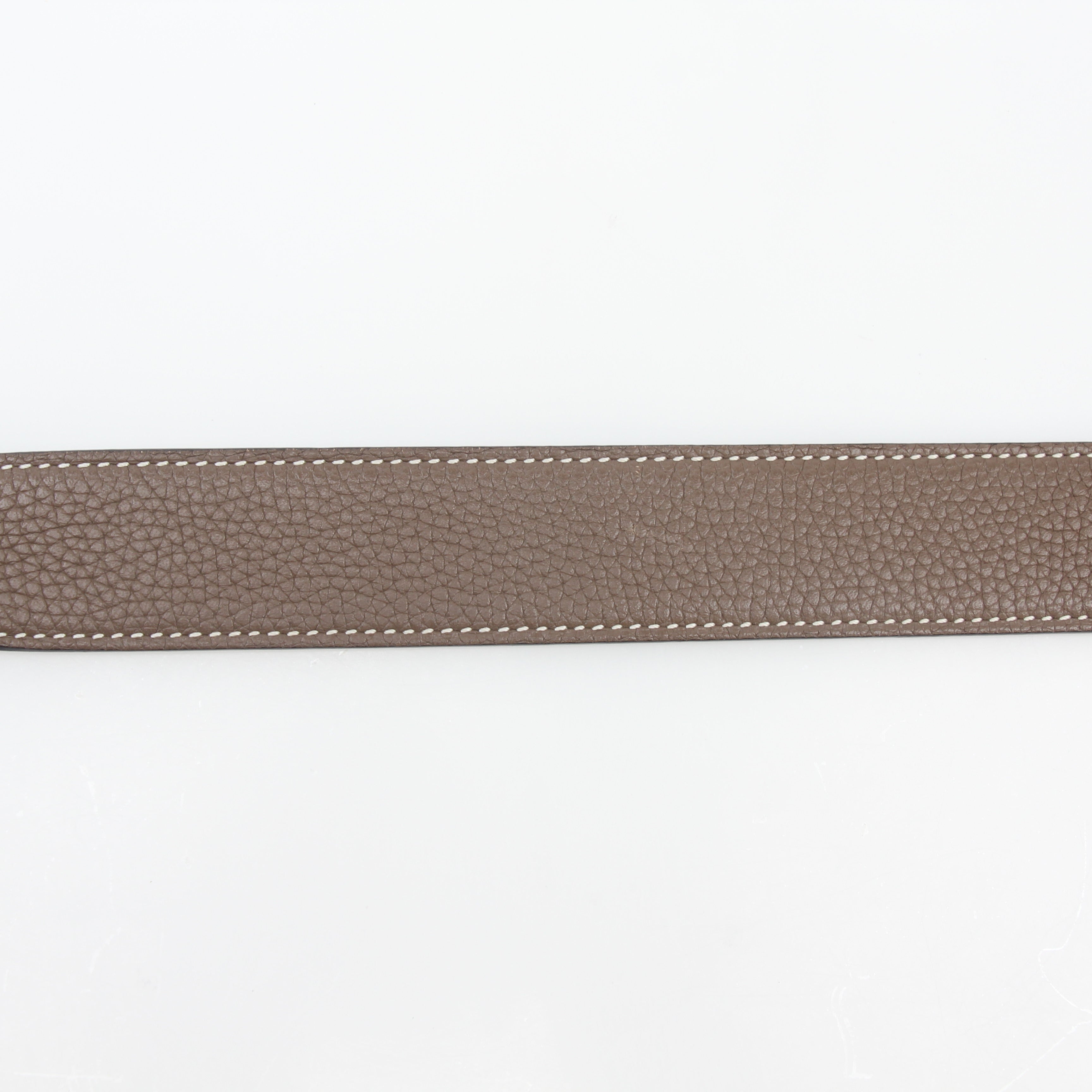 Hermès white and Etoupe reversible leather belt strap, 90/36, showcased on a flat surface with detailed texture and stitching.