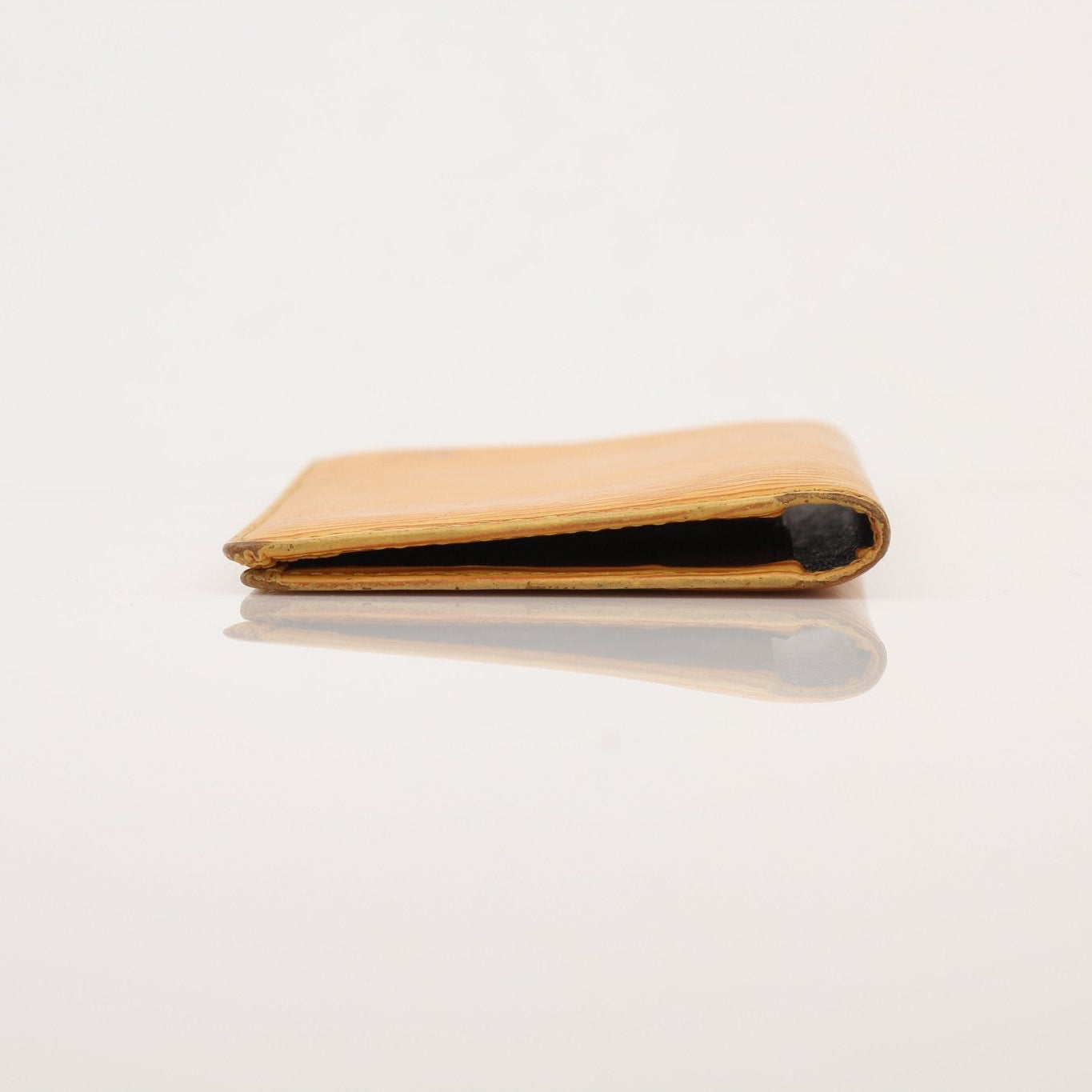 Louis Vuitton Epi yellow wallet by Gold & Beyond, showing the textured leather surface and compact, elegant design.