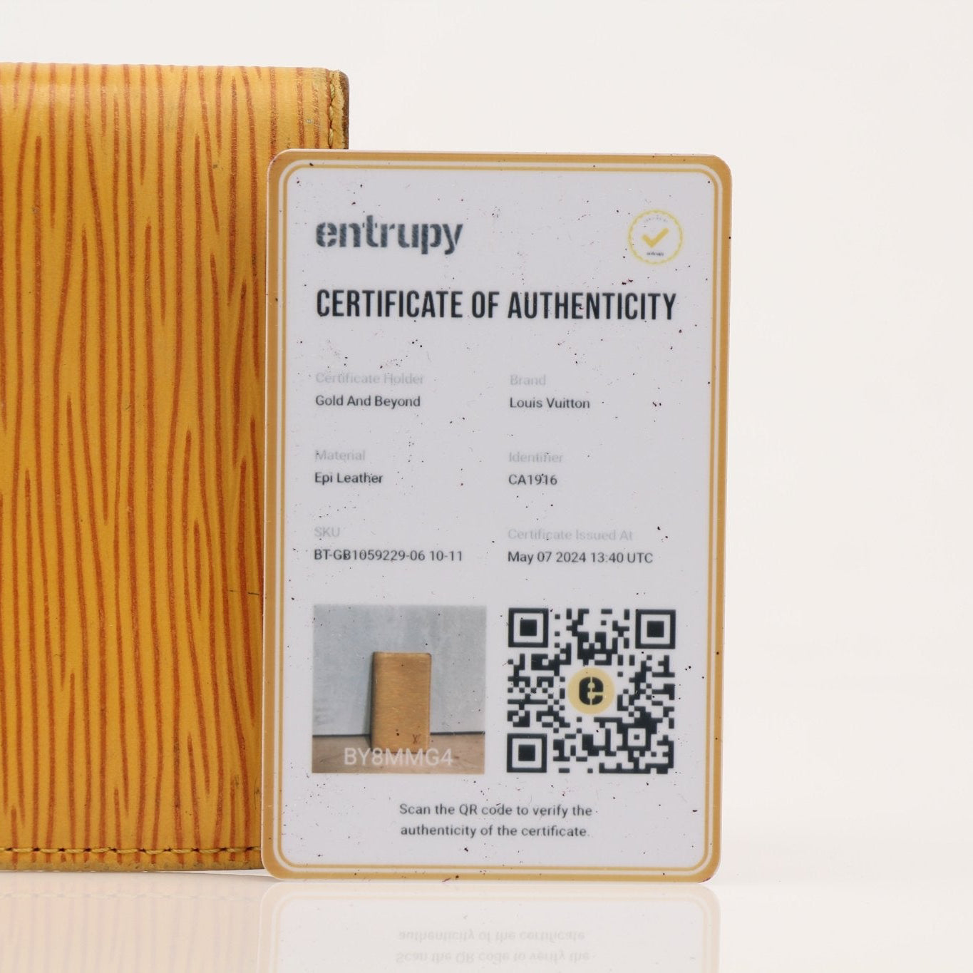 Yellow Louis Vuitton Epi leather wallet from Gold & Beyond, featuring a sleek design and gold-tone hardware.