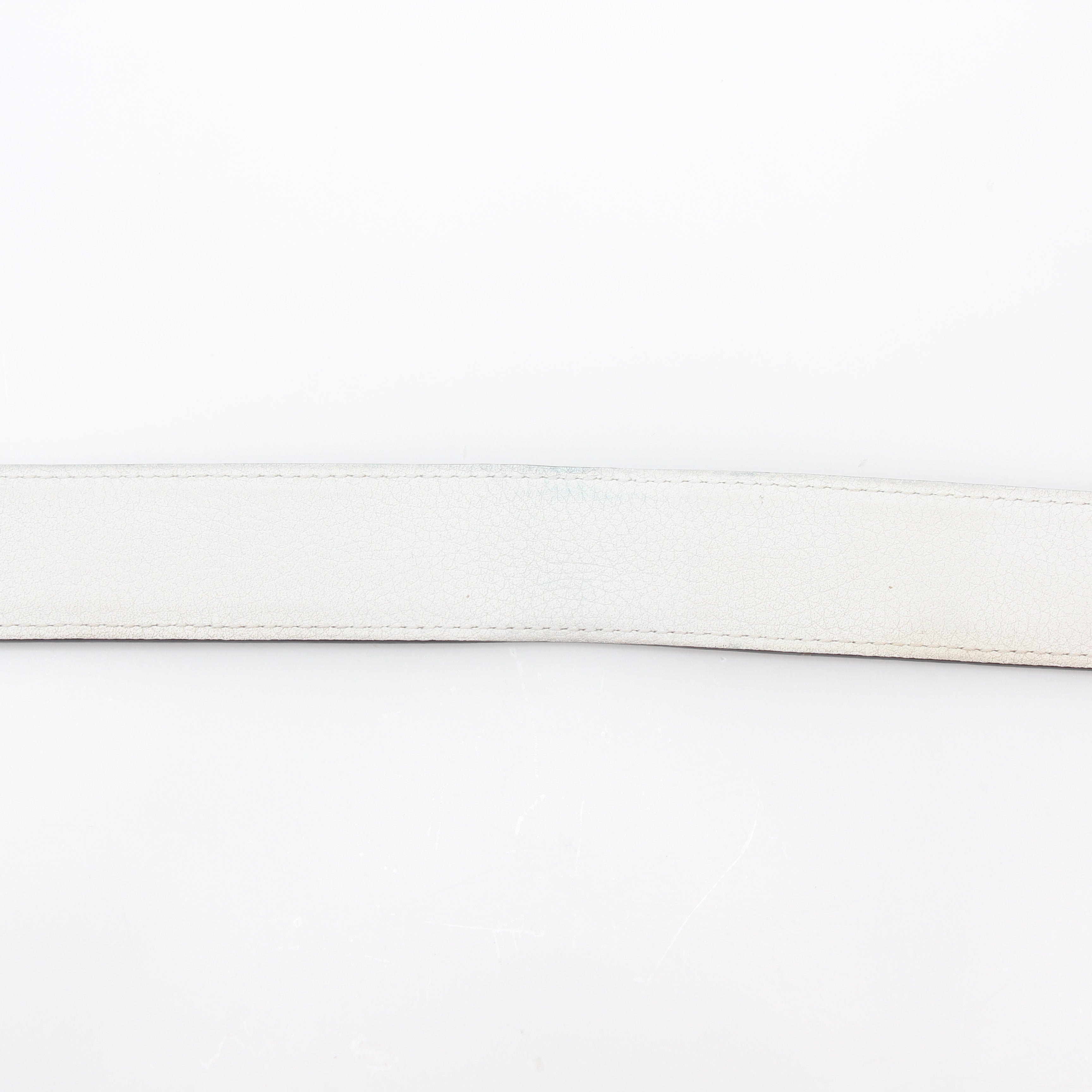 Hermès white and Etoupe reversible leather belt strap with gold hardware, 36 inches, displayed on a neutral background.