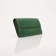 Gold & Beyond Louis Vuitton Epi Sarah Wallet Ora, close-up view showing textured Epi leather and compact wallet design.
