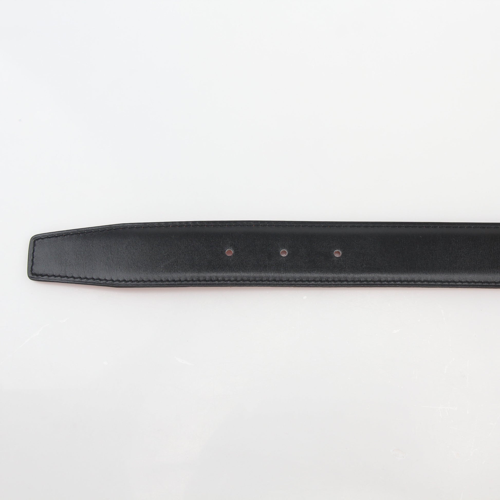 Hermès black and orange reversible belt kit with H buckle, featuring Gold & Beyond branding and multiple strap options.