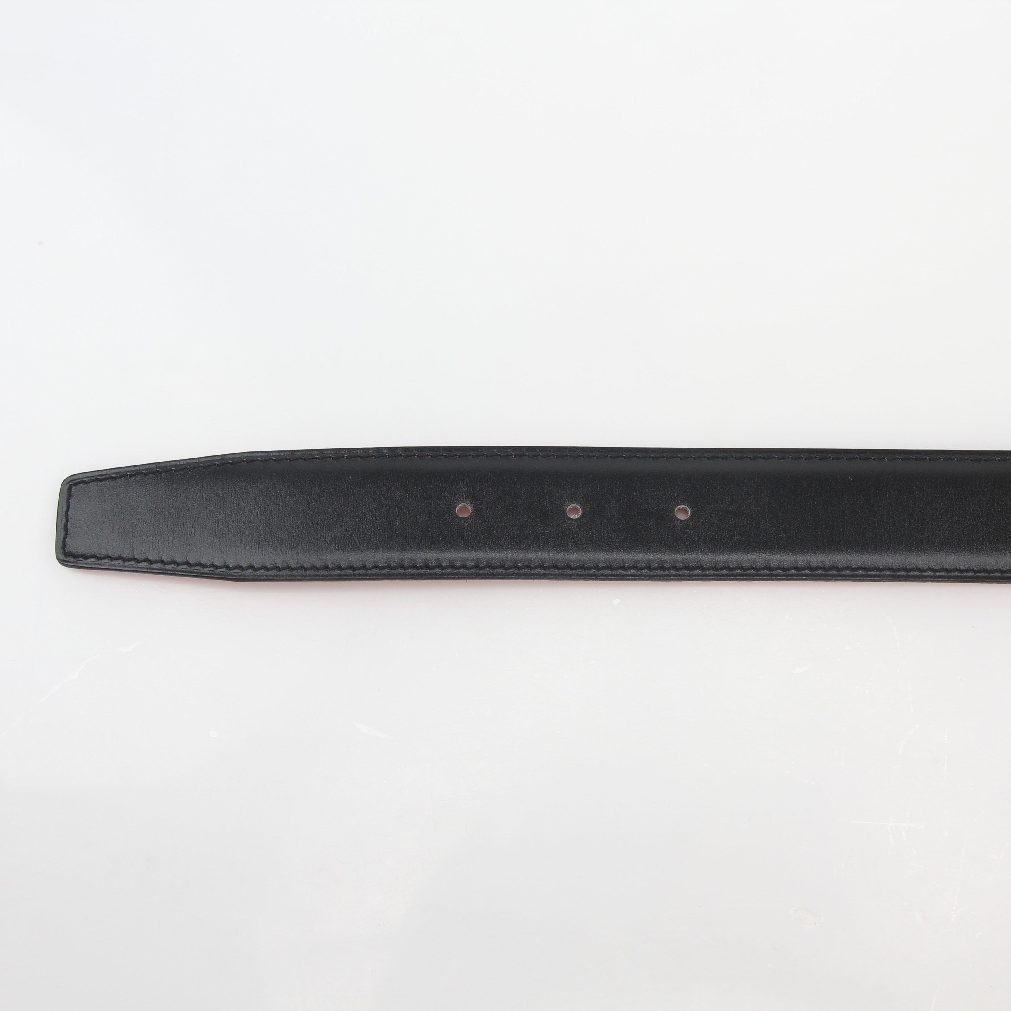 Hermès black and orange reversible belt kit with H buckle, featuring Gold & Beyond branding and multiple strap options.