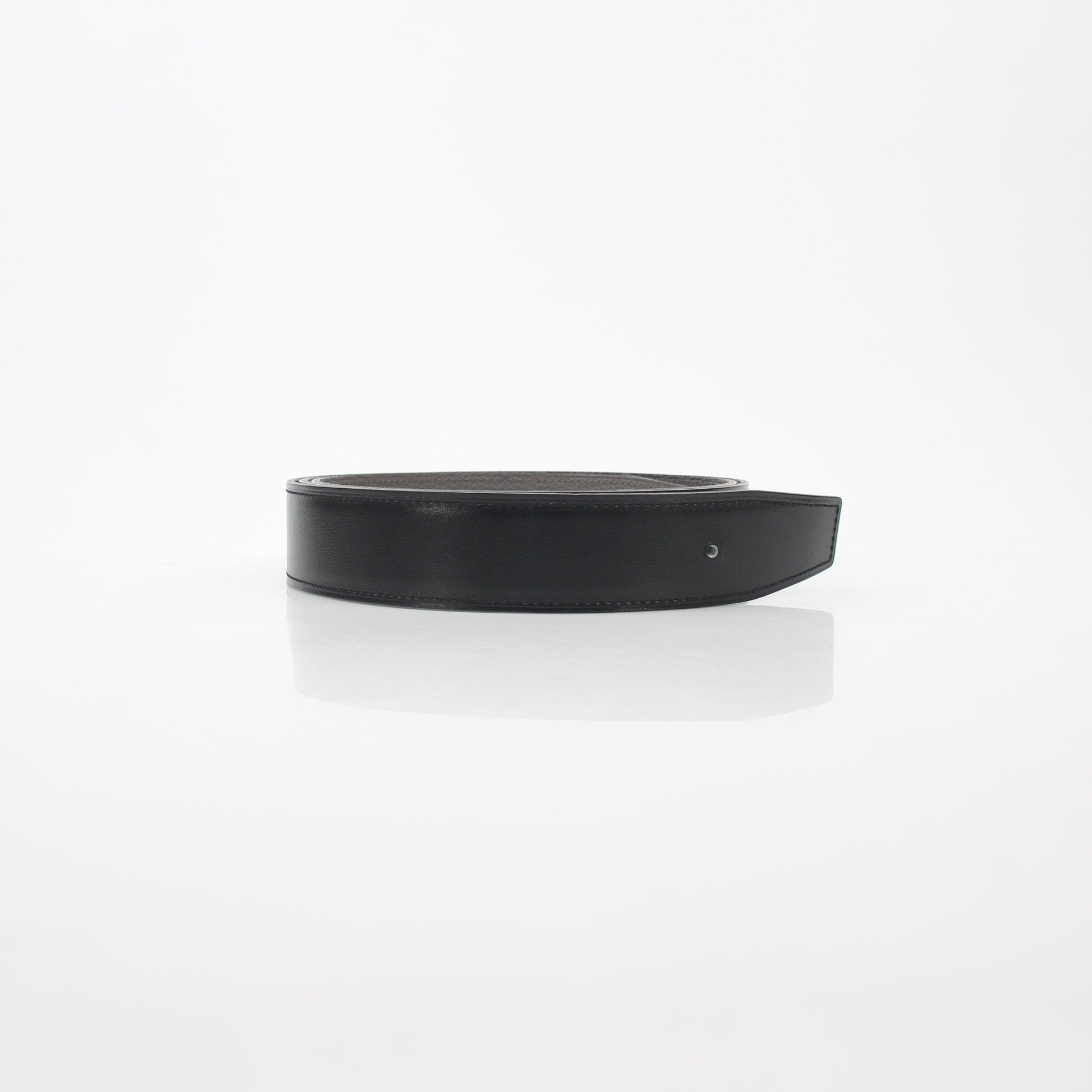 Hermès black and etoupe reversible leather belt strap for accessories by Gold & Beyond, showing textured leather and reversible design.