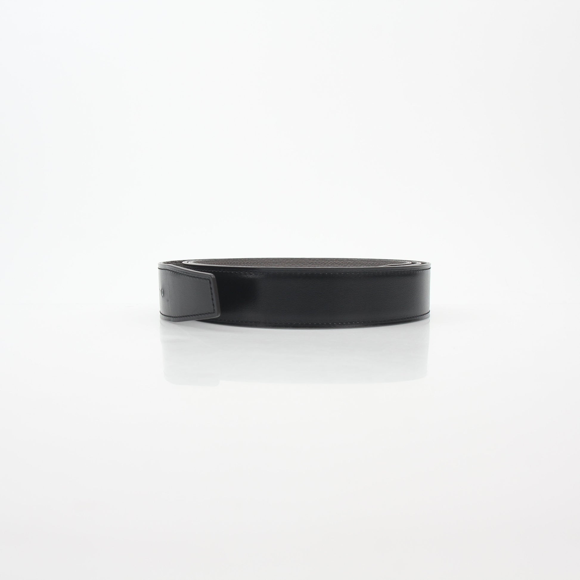 Hermès black and etoupe reversible leather belt strap for accessories, showcasing smooth leather and versatile design.
