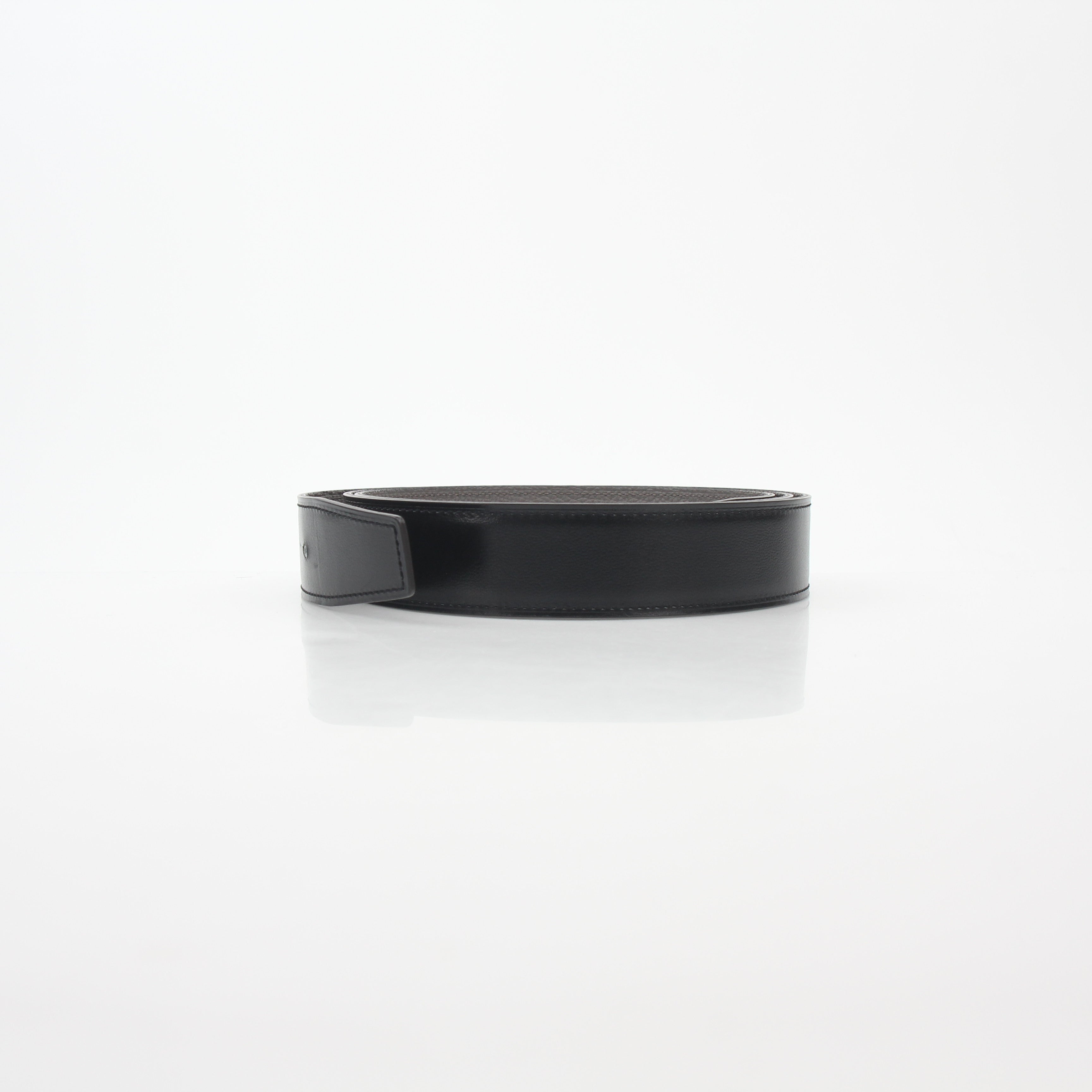 Hermès black and etoupe reversible leather belt strap for accessories, showcasing smooth leather and versatile design.