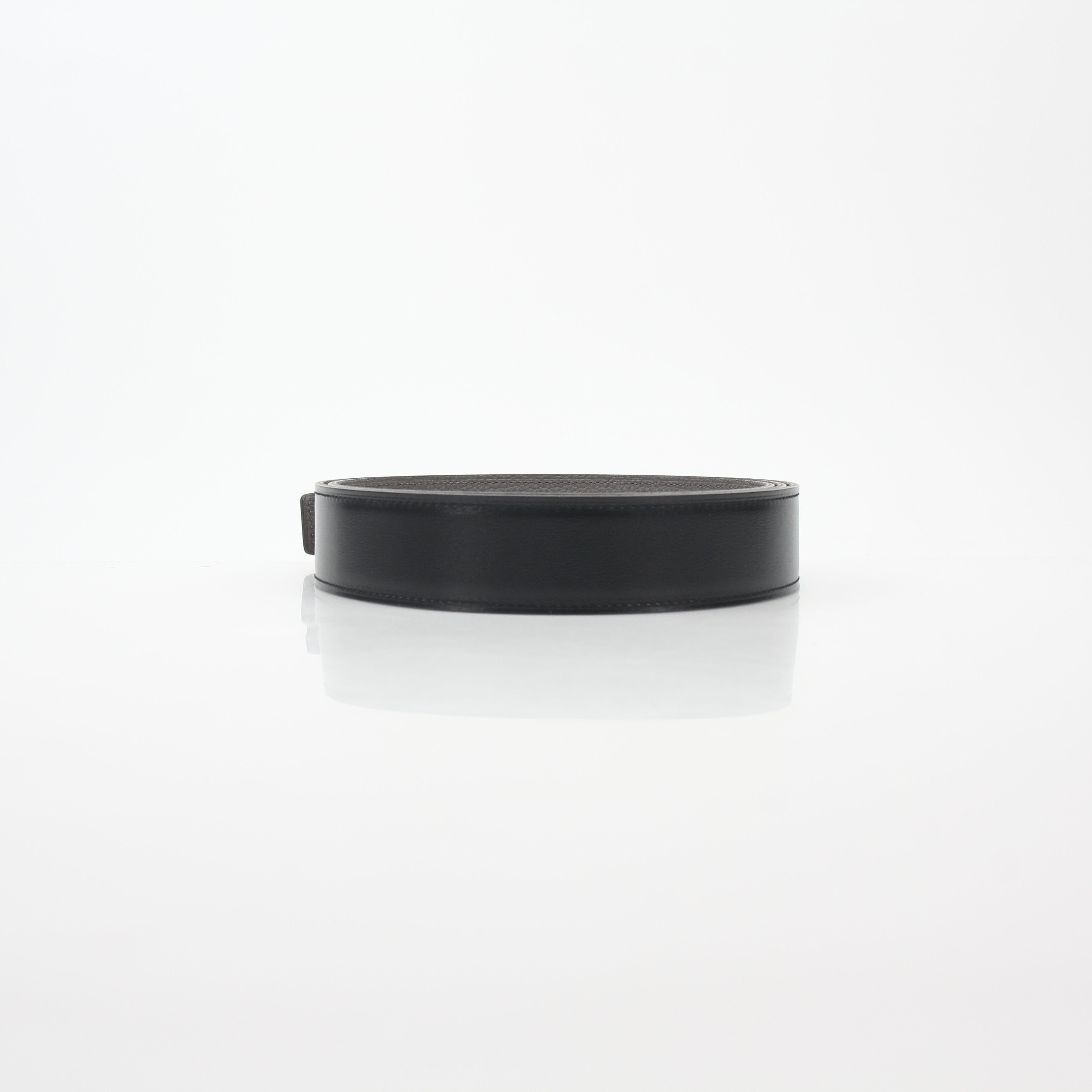Hermès black and Etoupe reversible leather belt strap for accessories, showcasing smooth leather and reversible design.