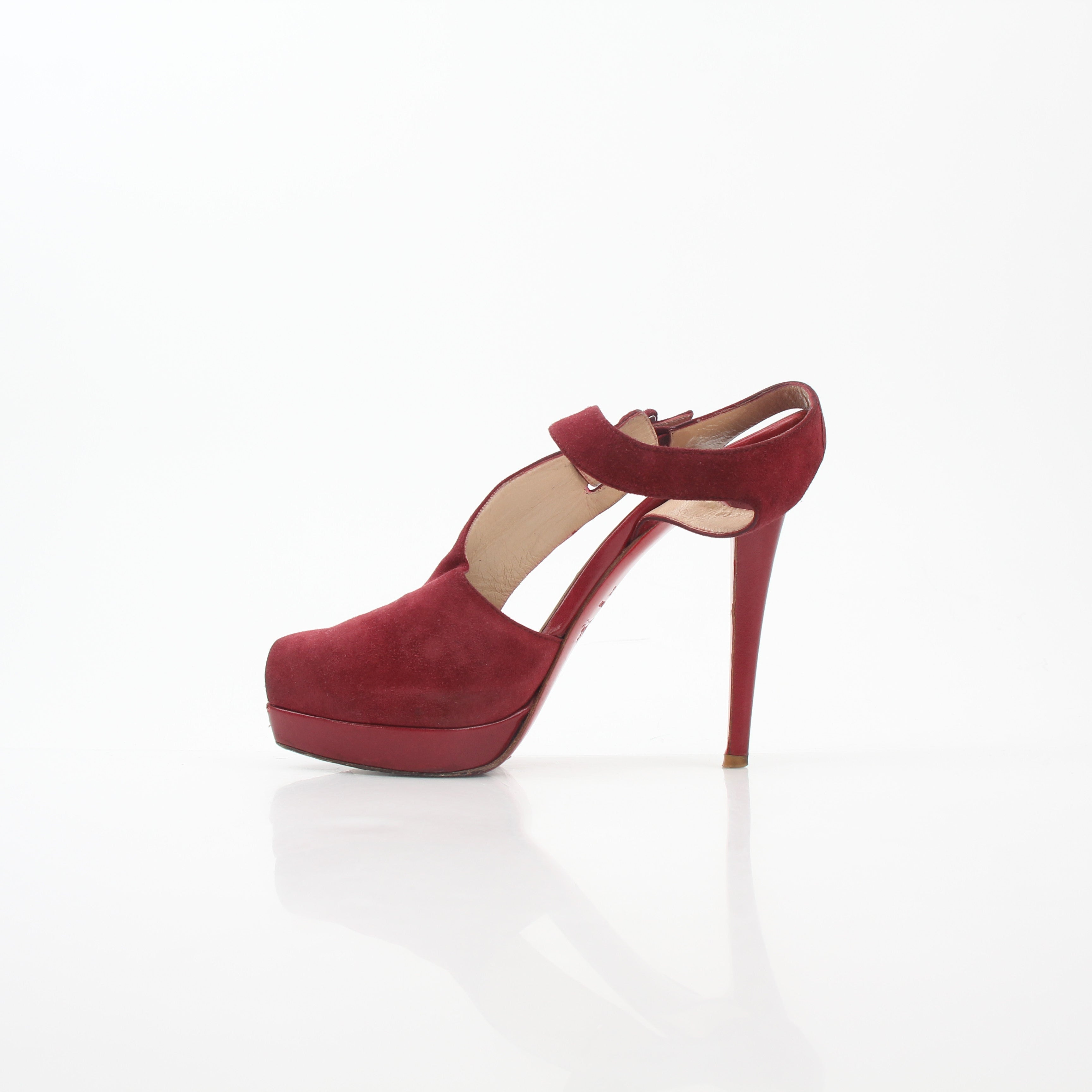Christian Louboutin Red Orlan 140 suede T-strap heels with stiletto heel and elegant design, displayed on a neutral background.