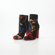 Christian Louboutin Moulamax floral velvet ankle boots, stylish shoes featuring vibrant floral embroidery and a sleek design.