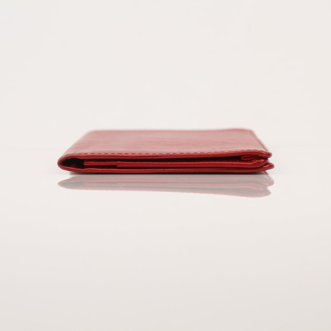 Louis Vuitton Epi checkbook wallet by Gold & Beyond, featuring textured leather and multiple card slots.