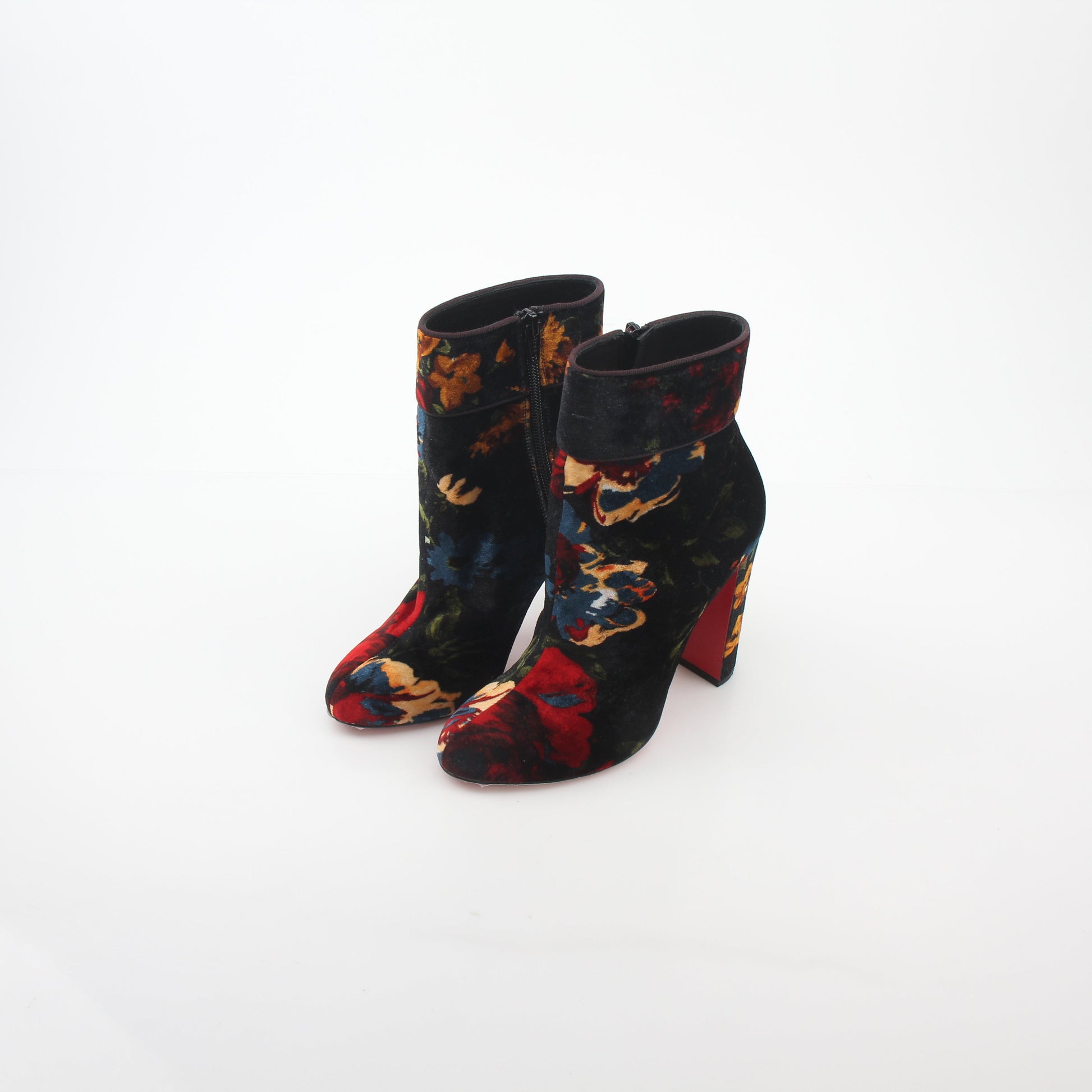 Christian Louboutin Moulamax floral velvet ankle boots with vibrant floral embroidery and sleek black heels.