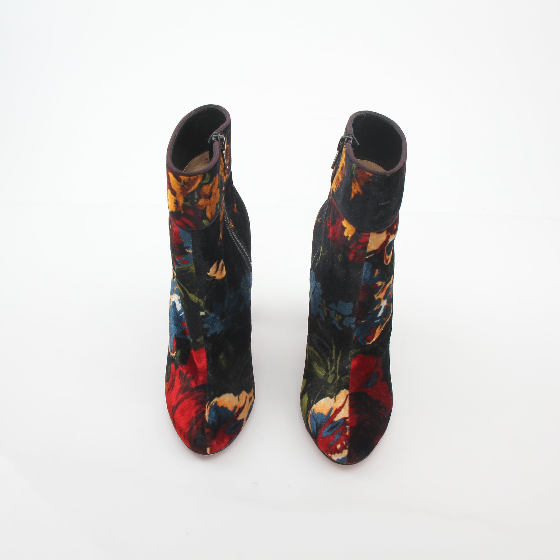 Christian Louboutin Moulamax floral velvet ankle boots with elegant design and vibrant floral pattern.