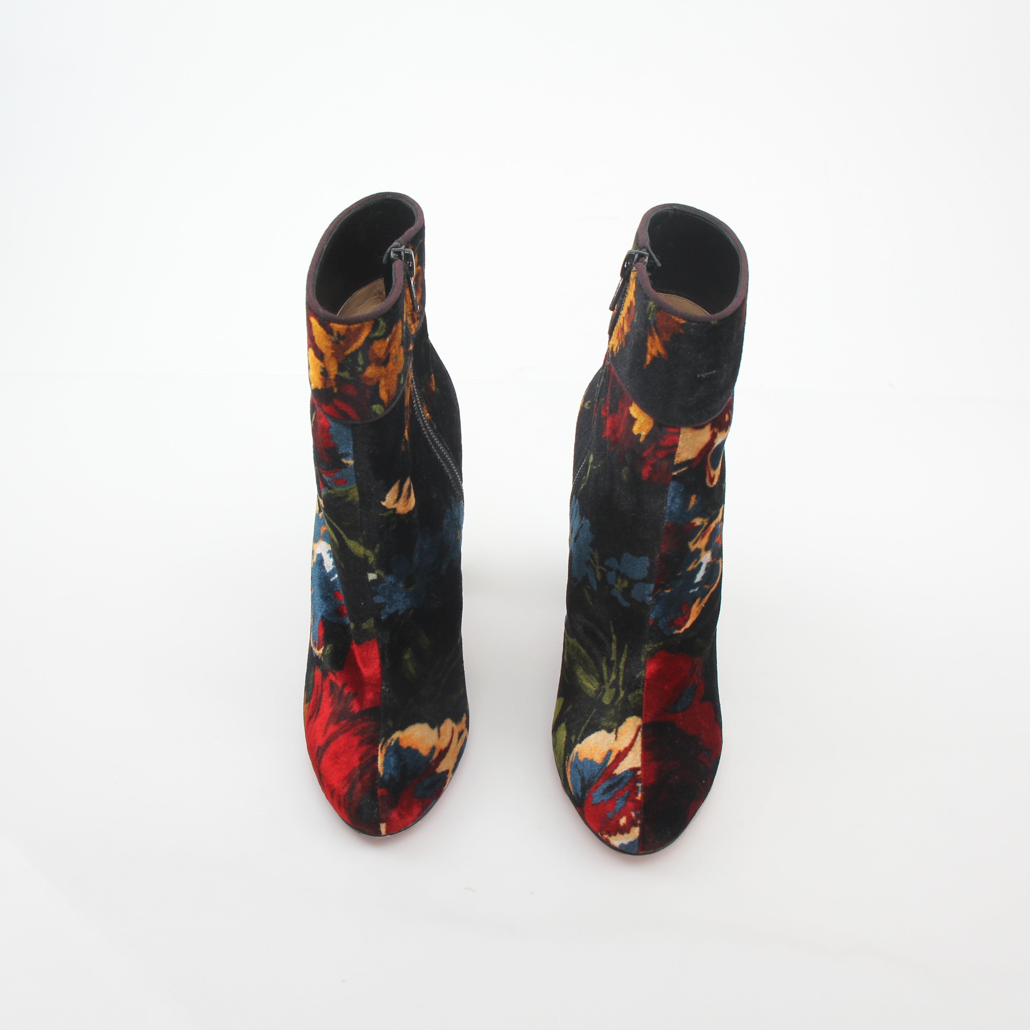 Christian Louboutin Moulamax floral velvet ankle boots with elegant design and vibrant floral pattern.