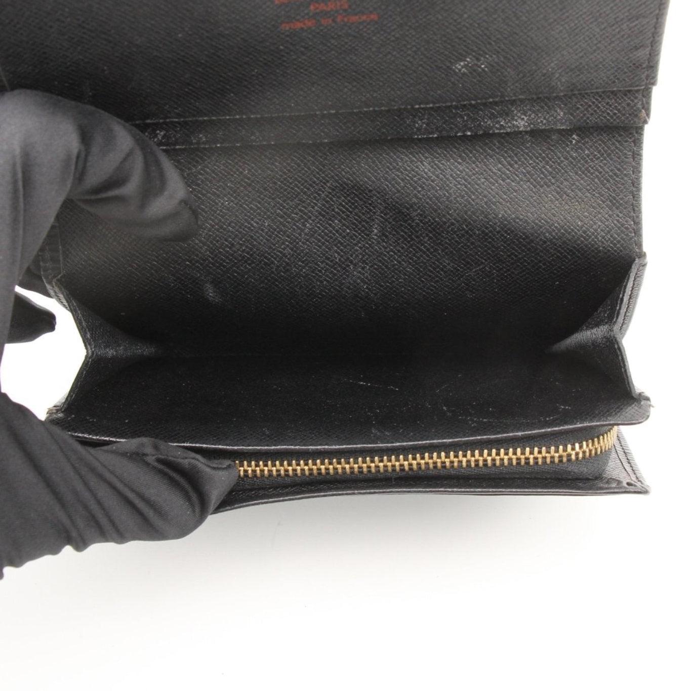 Louis Vuitton Epi Ebene wallet by Gold & Beyond, showcasing the textured leather and sleek design.