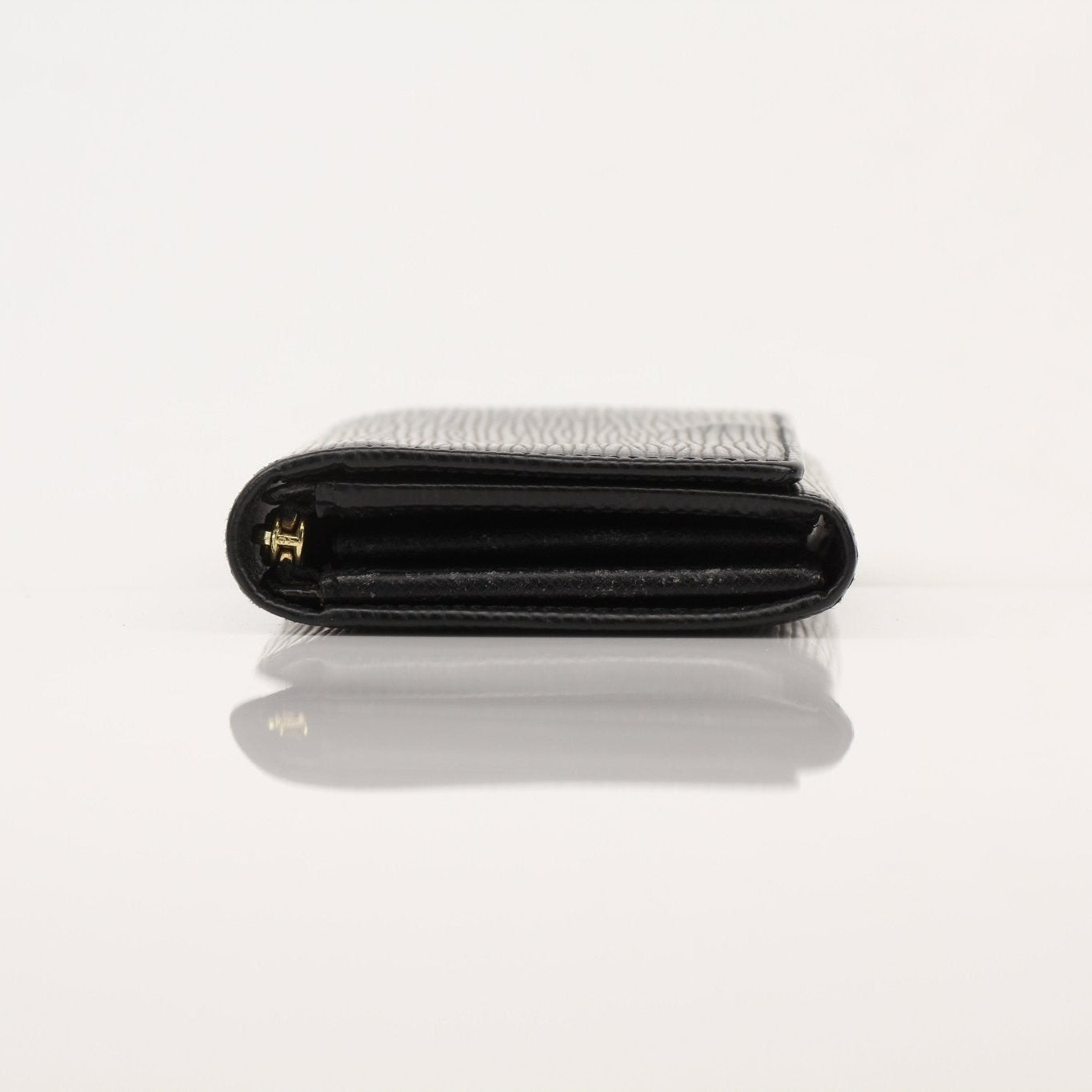 Louis Vuitton Epi Ebene wallet with gold accents, showcasing textured leather and multiple card slots on a neutral background.