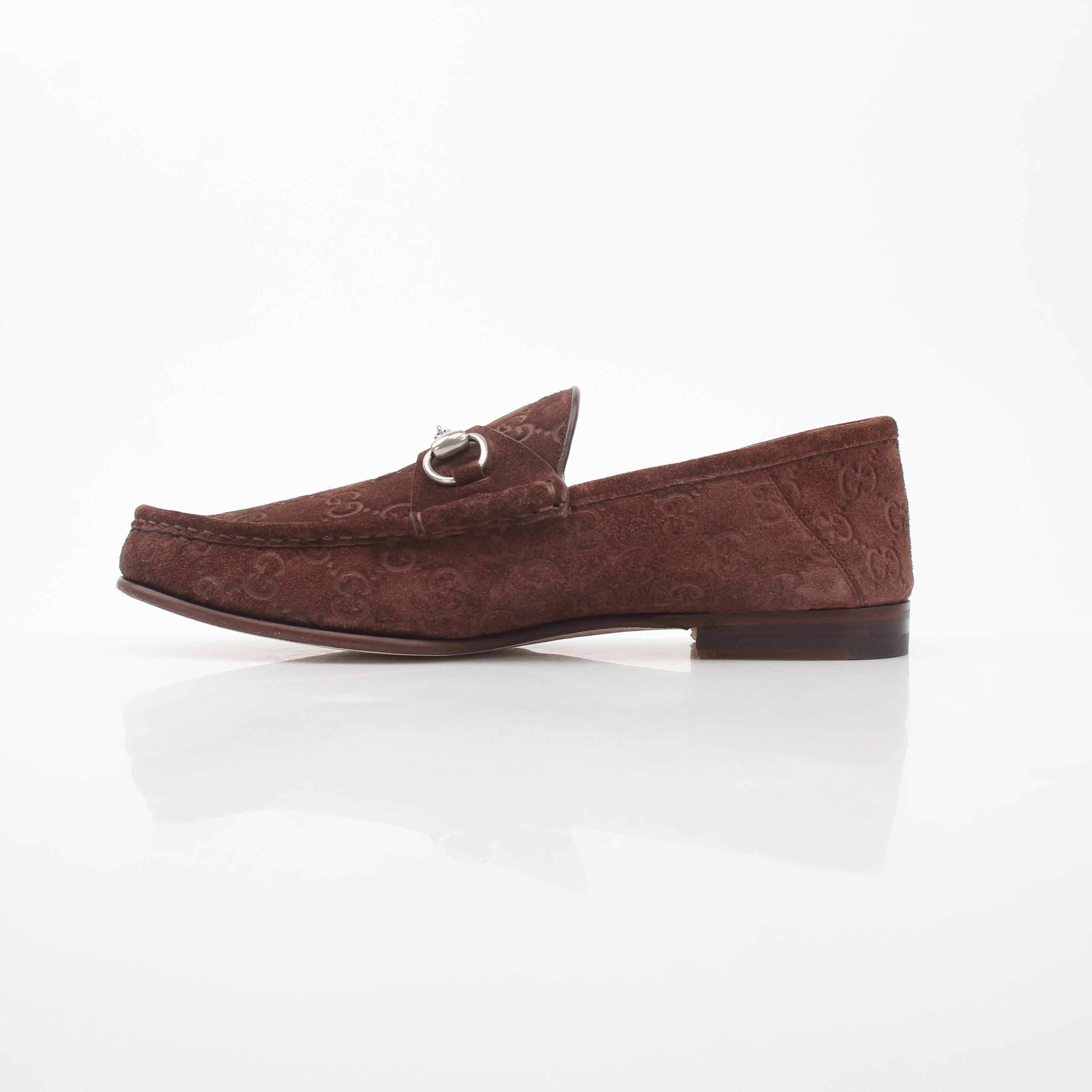 Gucci brown GG suede Horsebit 1953 loafers, stylish men's shoes with leather detailing and classic branding, on a neutral background