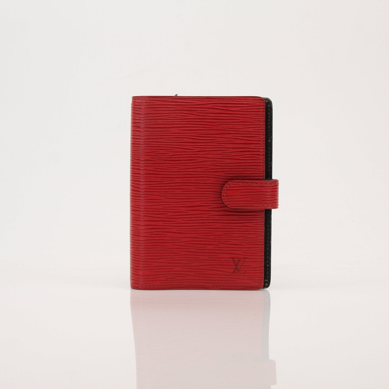 Louis Vuitton Epi Agenda Planner accessory with textured leather cover and gold hardware detailing.