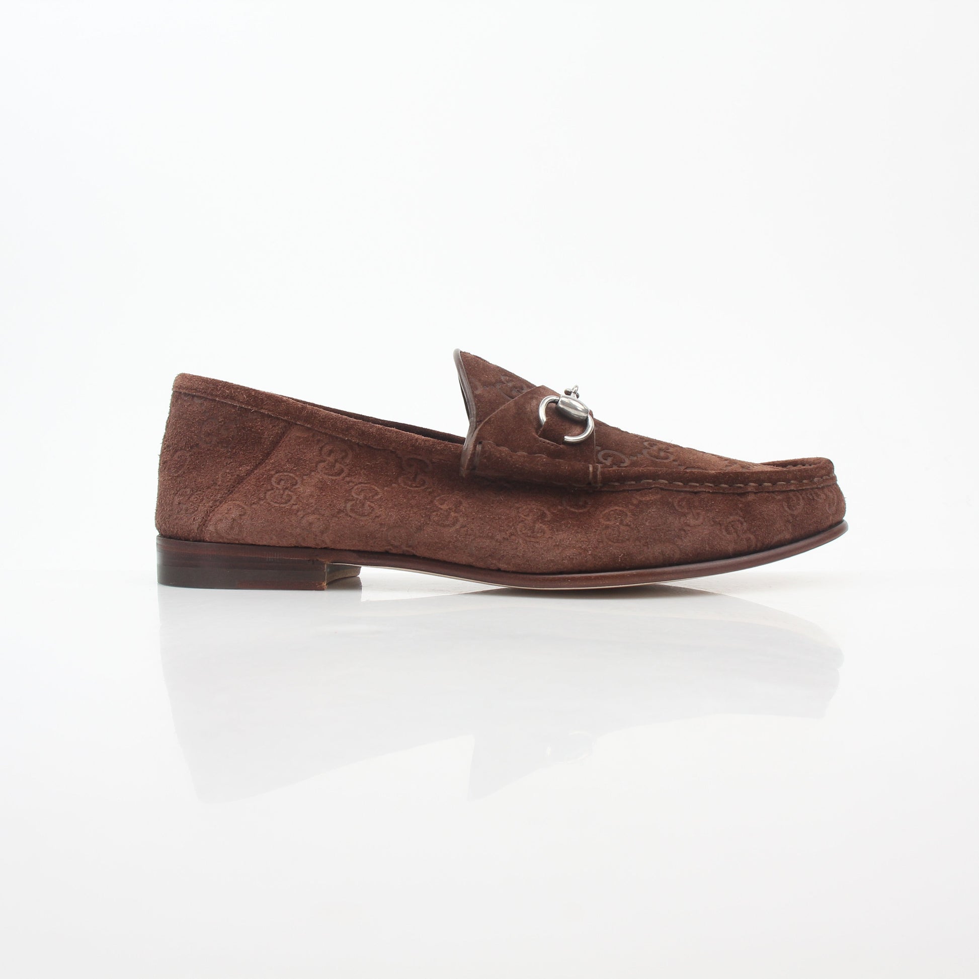 Gold & Beyond Gucci brown GG suede Horsebit 1953 loafers shoe with classic design and gold hardware detail.