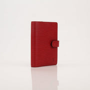 Louis Vuitton Epi Agenda Planner in textured leather with gold accents, showcasing its compact, stylish accessories design.