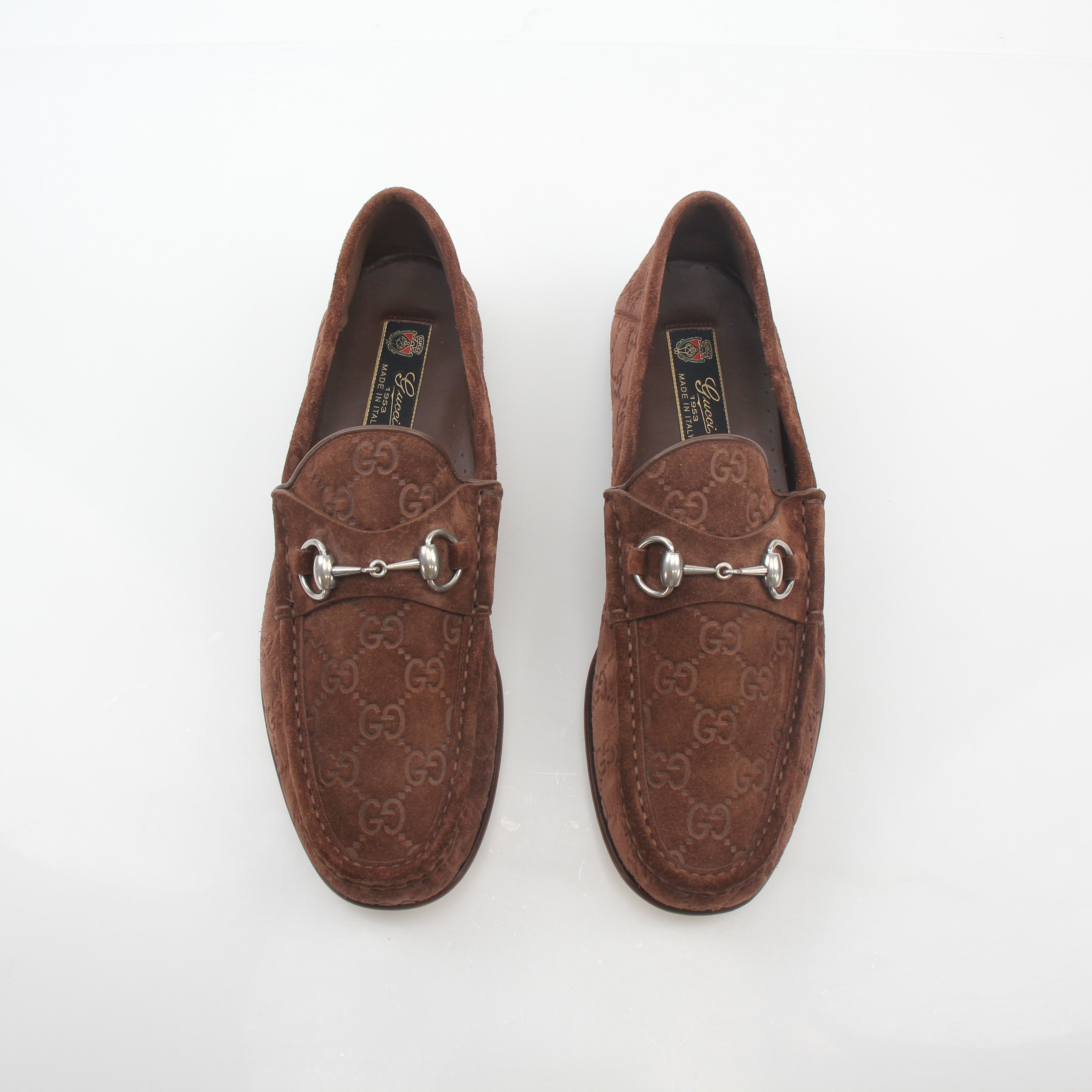 Gucci brown GG suede Horsebit 1953 loafers, stylish shoes with gold accents, displayed on a neutral background.