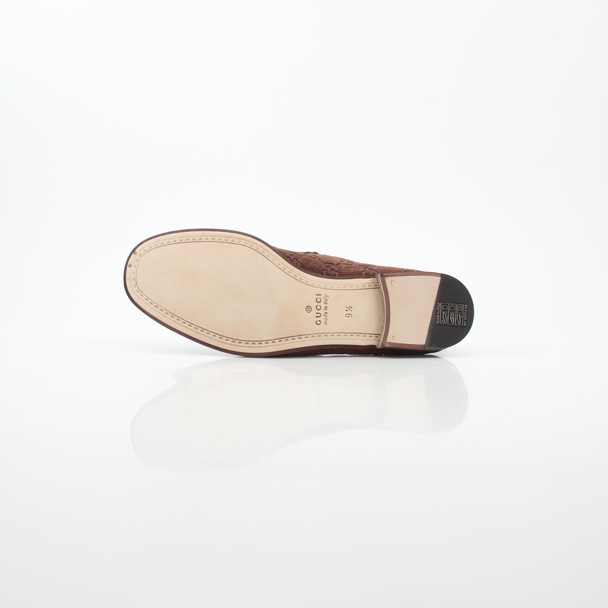 Gucci brown GG suede Horsebit 1953 loafers for men, stylish leather shoes with gold horsebit detail, on a white background.