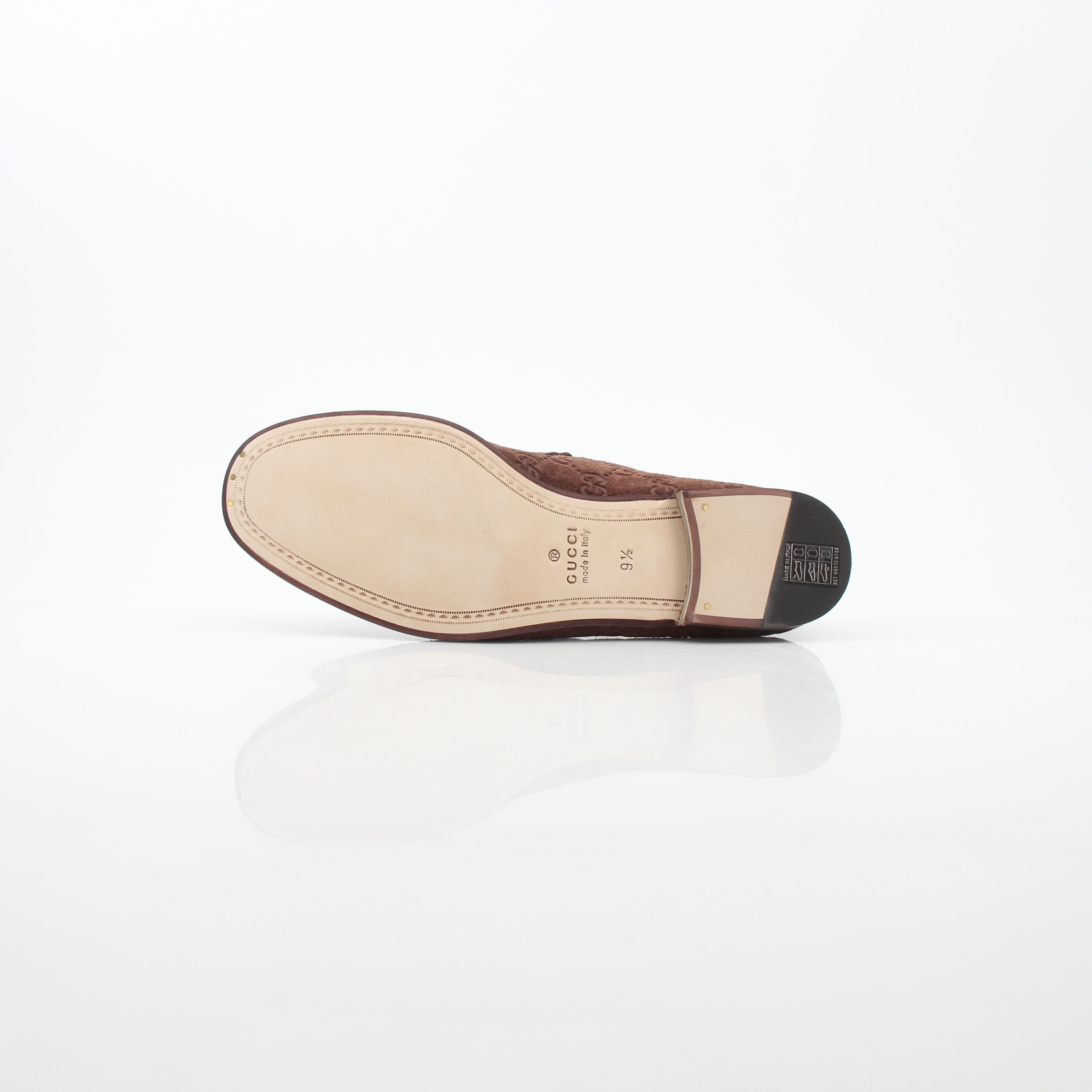 Gucci brown GG suede Horsebit 1953 loafers for men, stylish leather shoes with gold horsebit detail, on a white background.