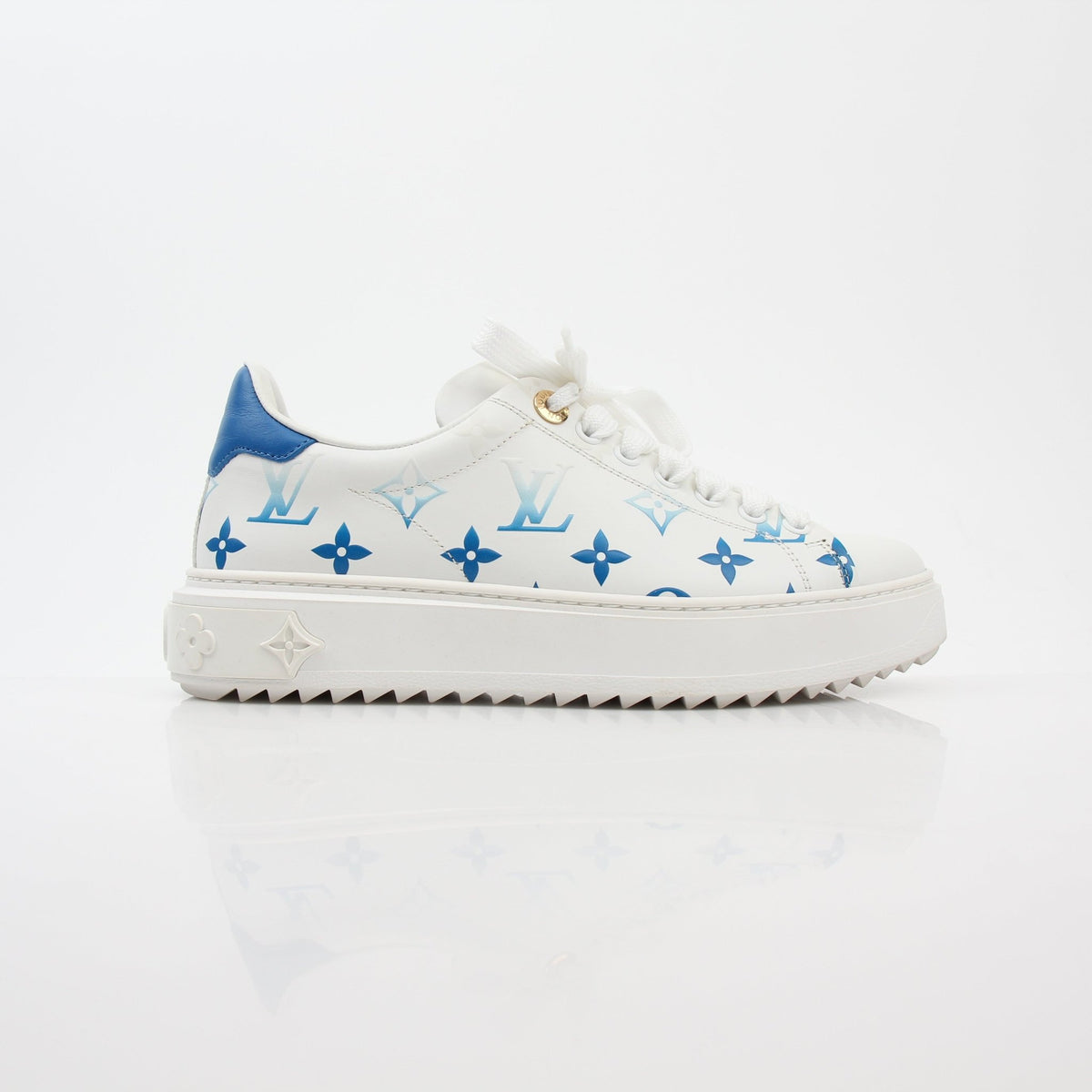 Louis Vuitton white and blue monogram Time Out sneakers, stylish shoes with gold accents, displayed on a neutral background.
