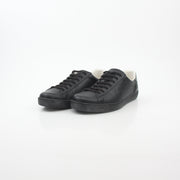 Gold & Beyond Gucci black leather Brooklyn low-top sneakers with sleek design and classic lace-up style.