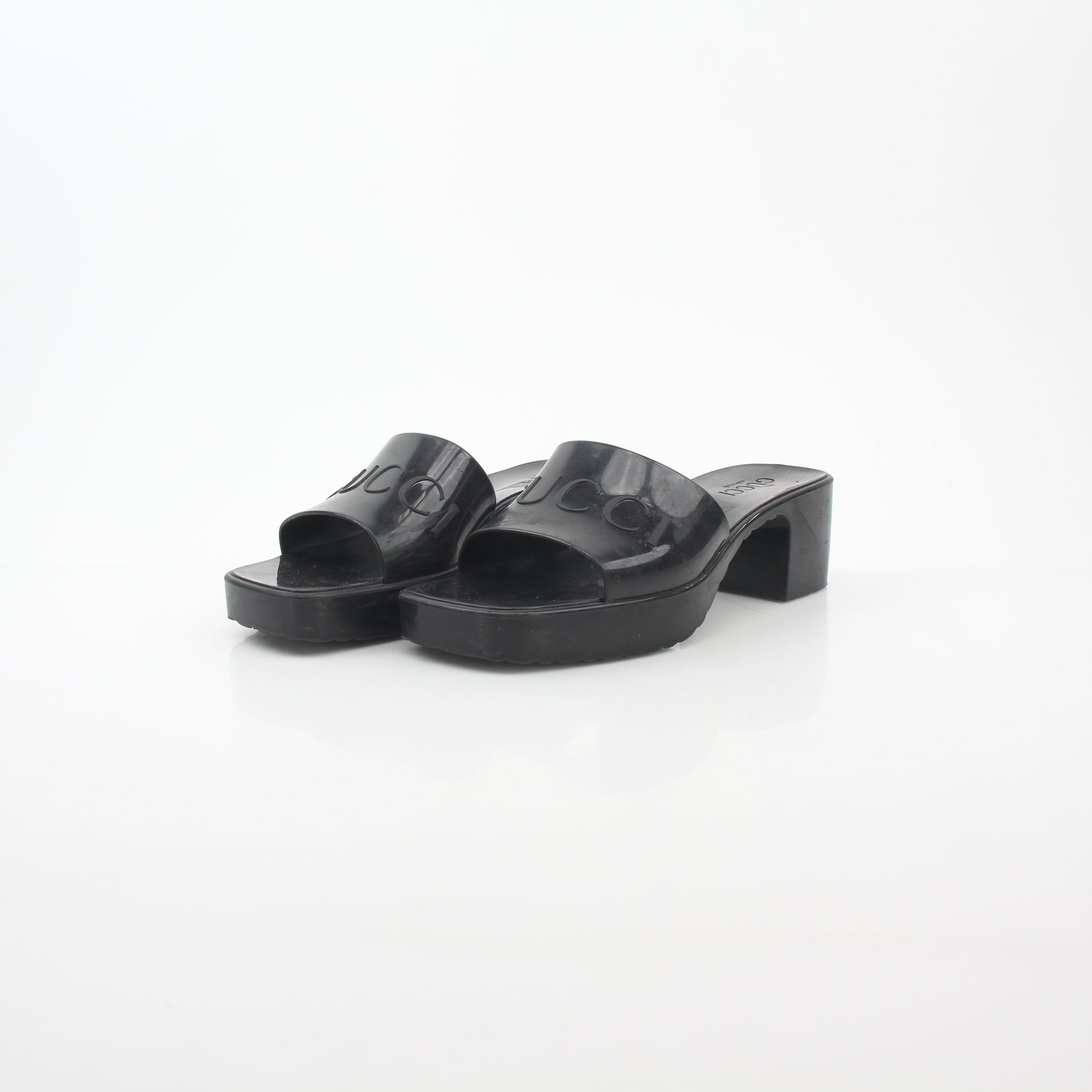 Gucci black rubber platform slide sandals with logo straps, stylish and comfortable shoes for casual wear.