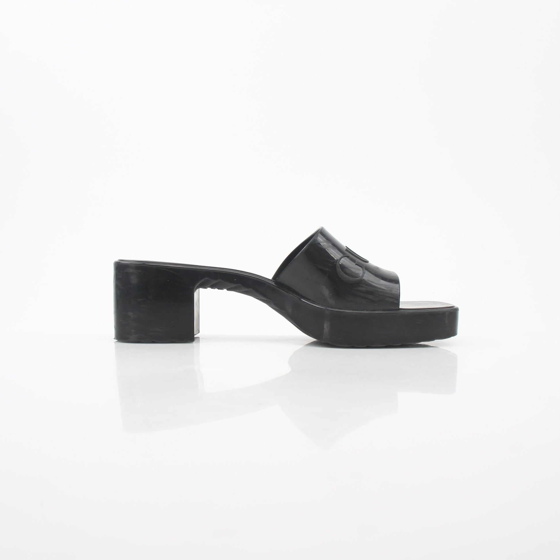 Gucci black rubber platform slide sandals with logo strap and chunky sole, stylish and comfortable for casual wear