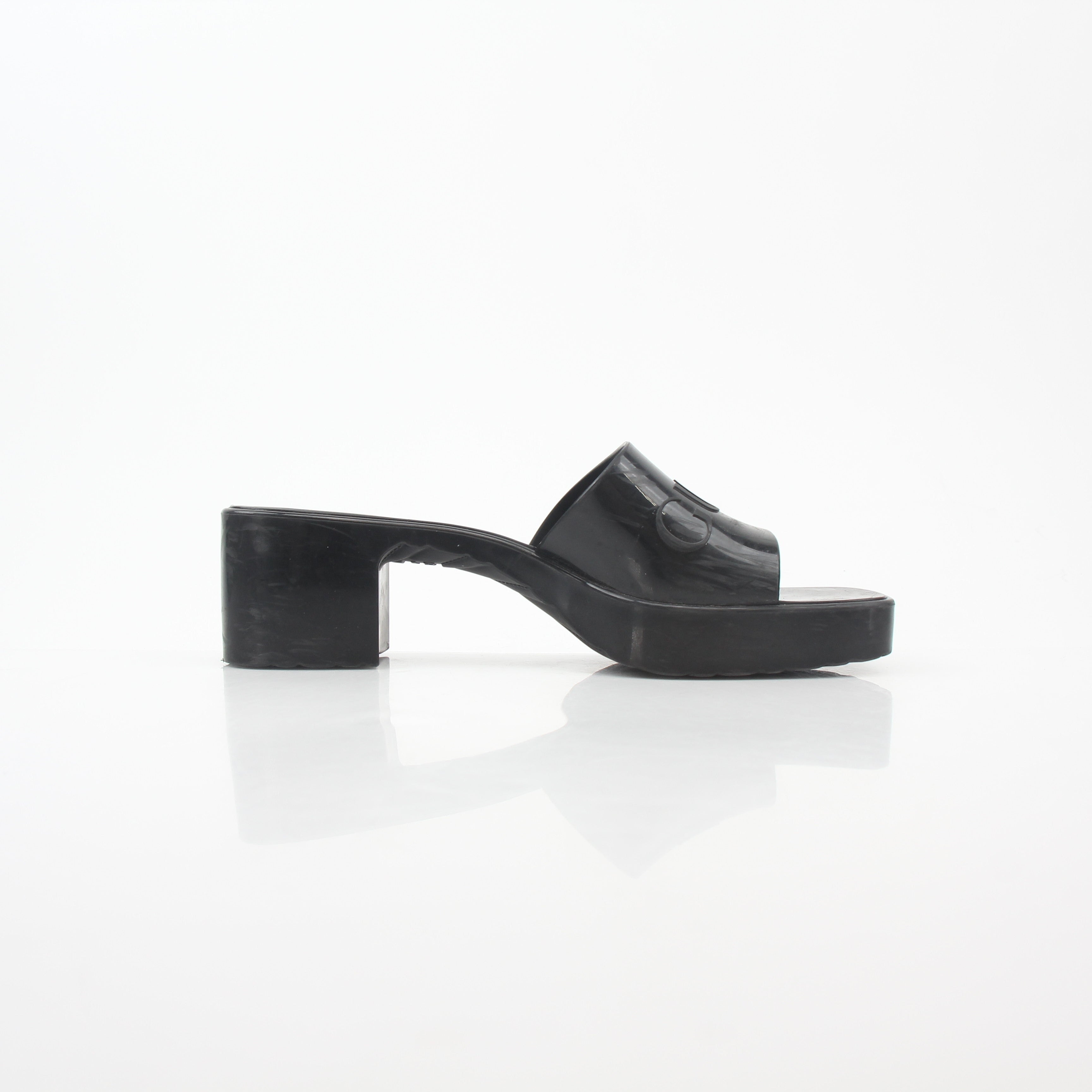 Gucci black rubber platform slide sandals with logo strap and chunky sole, stylish and comfortable for casual wear