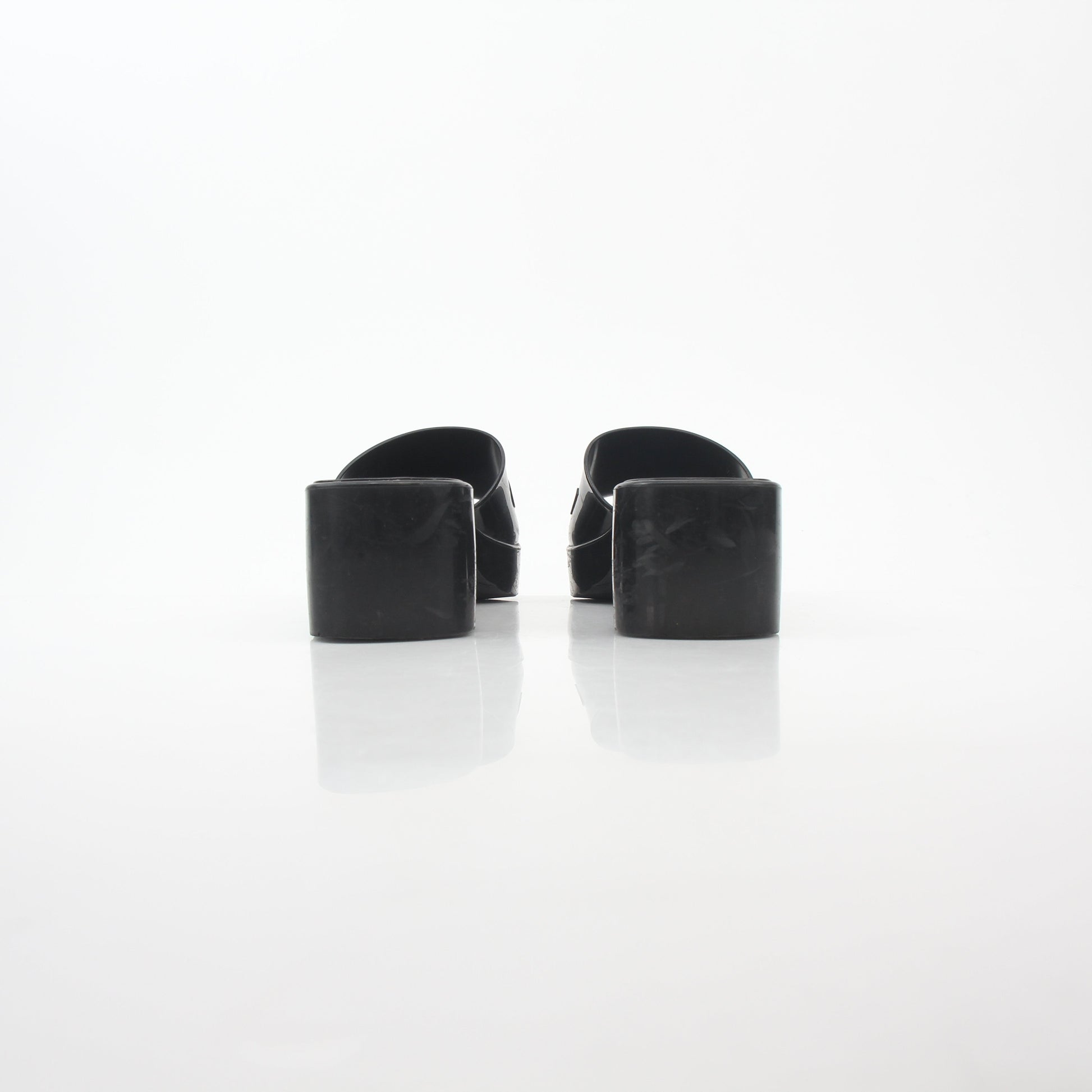 Gucci black rubber logo platform slide sandals with thick soles and wide straps, casual summer footwear by Gold & Beyond.