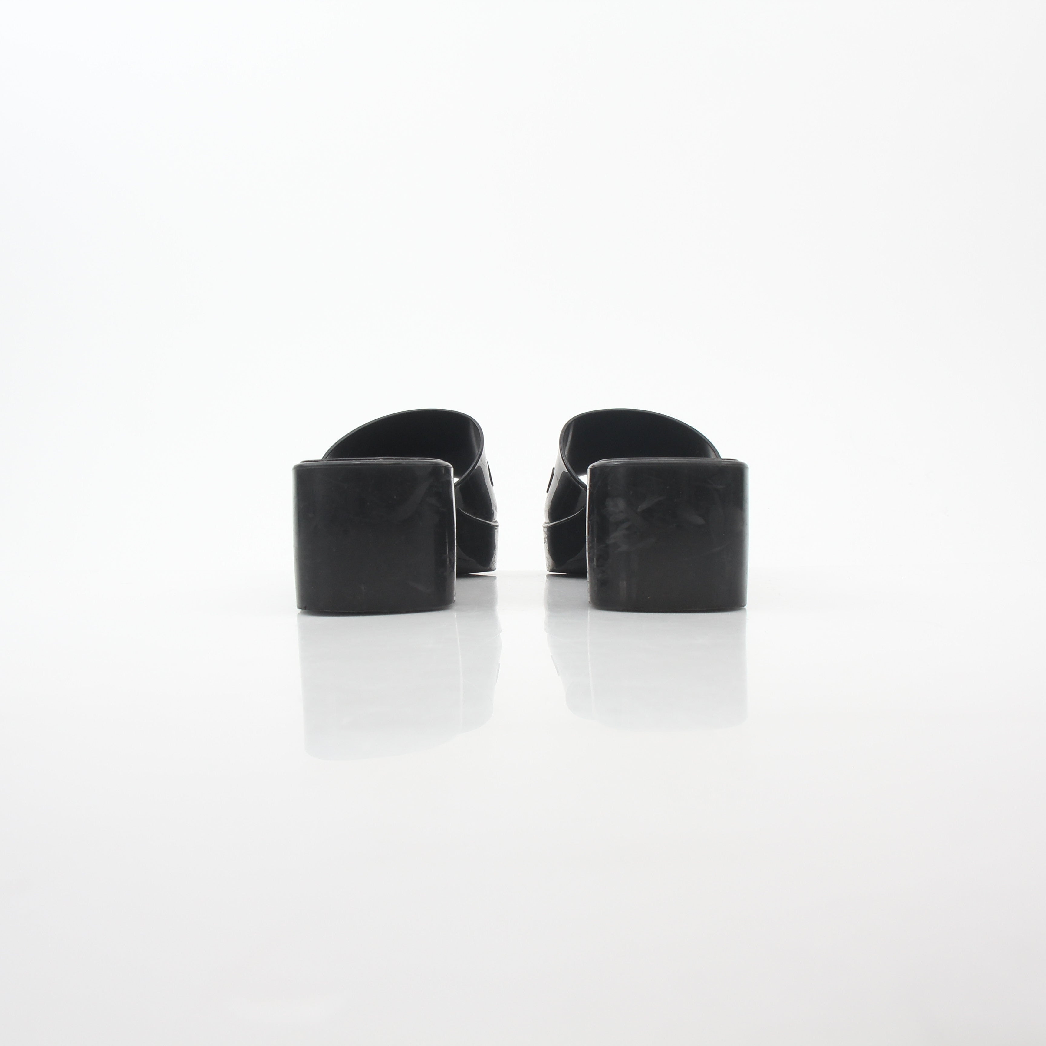 Gucci black rubber logo platform slide sandals with thick soles and wide straps, casual summer footwear by Gold & Beyond.
