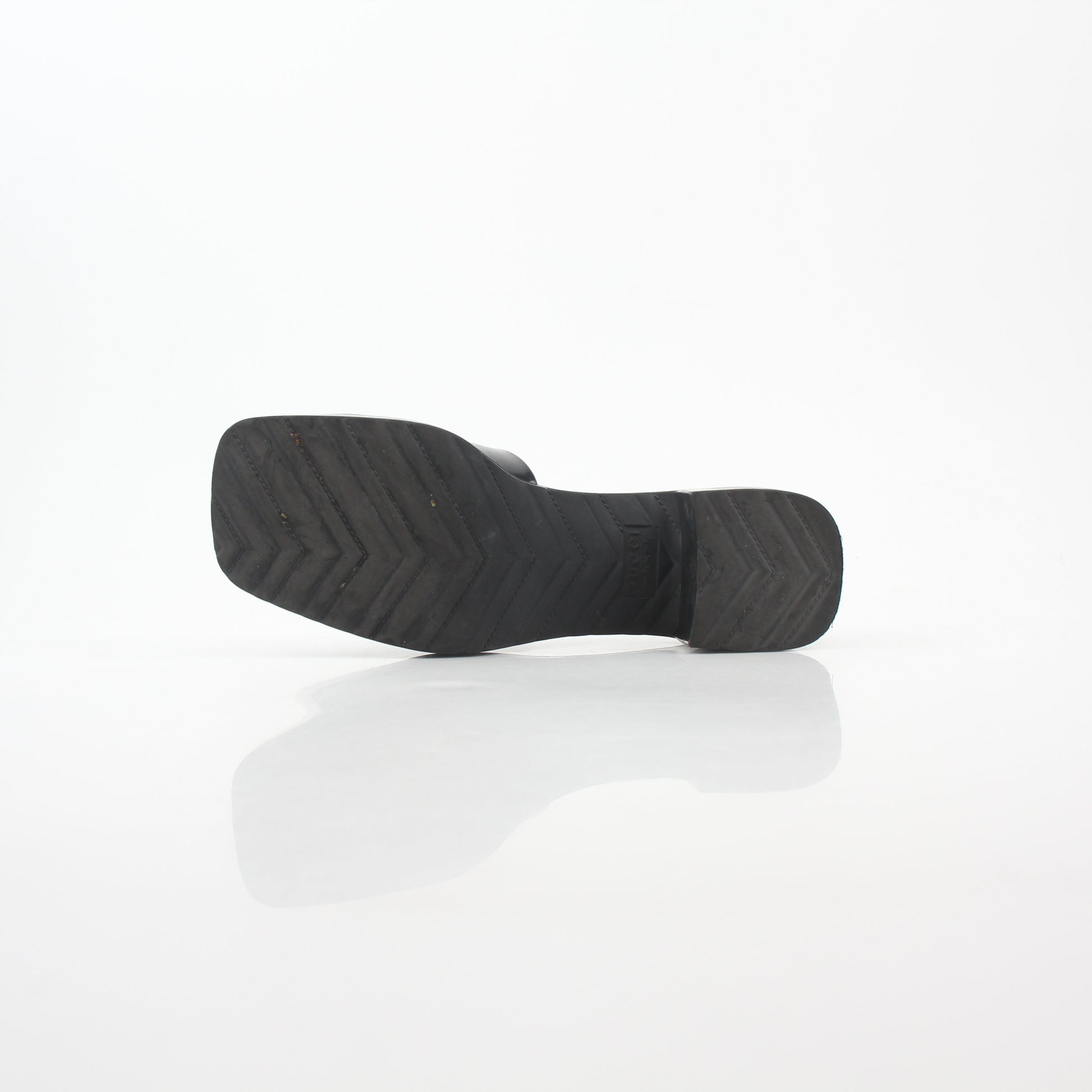 Gucci black rubber logo platform slide sandals featuring a sleek strap design and chunky platform sole.