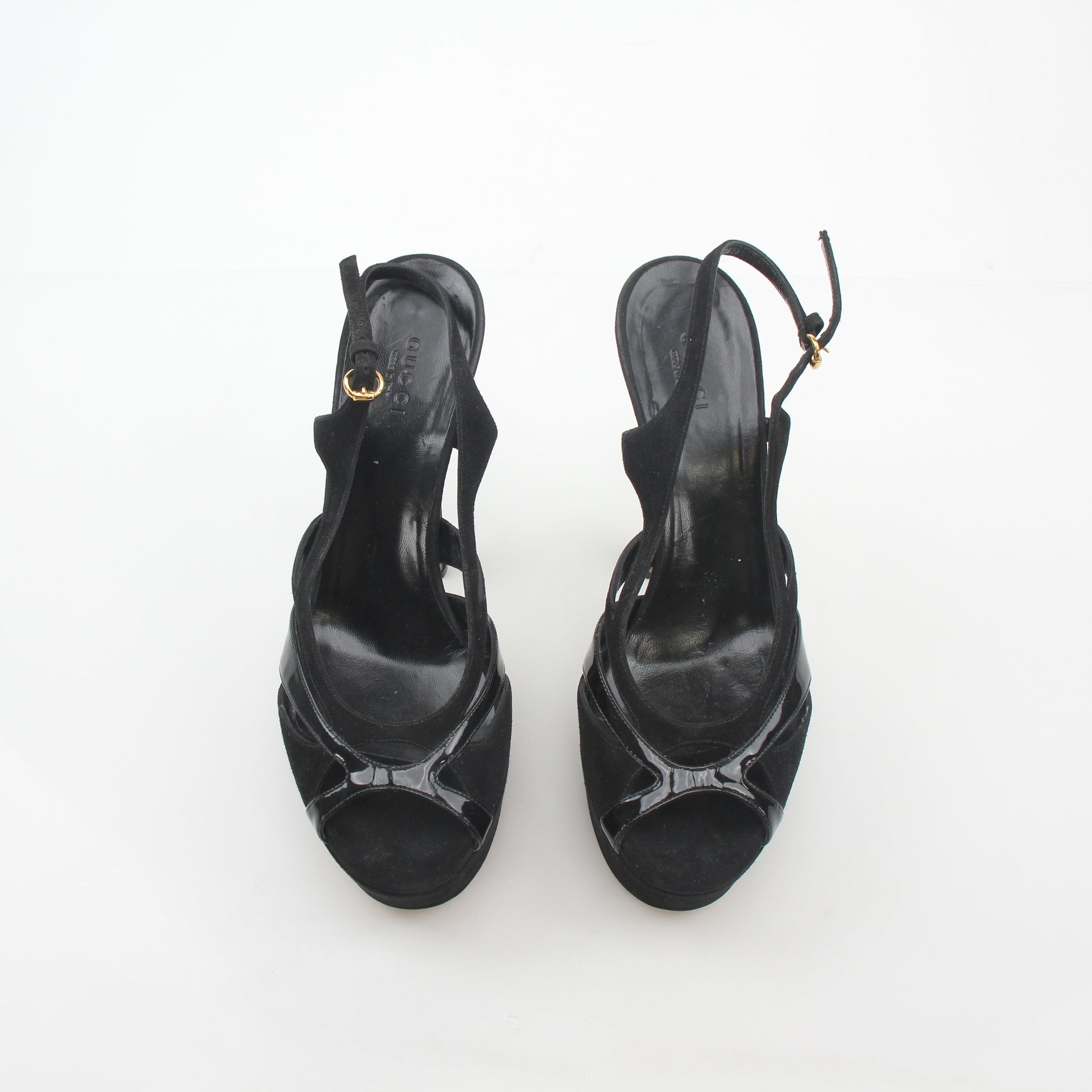 Gucci black suede and patent leather cutout platform slingback heels with chunky heels and ankle straps.