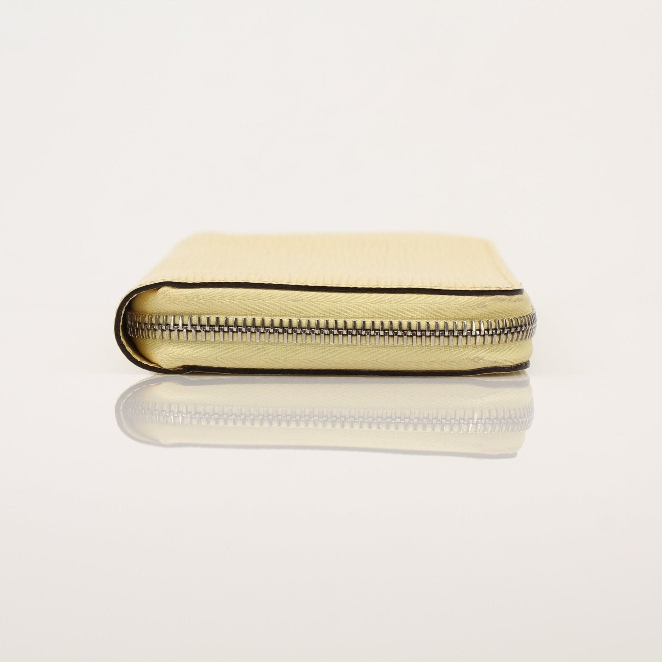 Louis Vuitton Epi Zippy Wallet in textured leather, featuring gold hardware and multiple card slots, displayed on a neutral background.