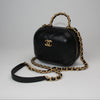 Chanel Matelassé vanity shoulder bag featuring a quilted design and elegant gold hardware on a neutral background.