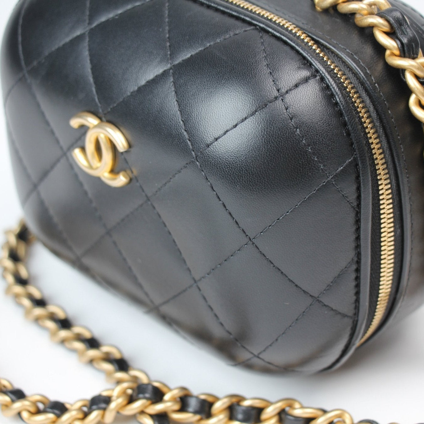 Chanel Matelassé Vanity Shoulder Bag in elegant quilted leather with a gold chain strap, showcasing a stylish design.
