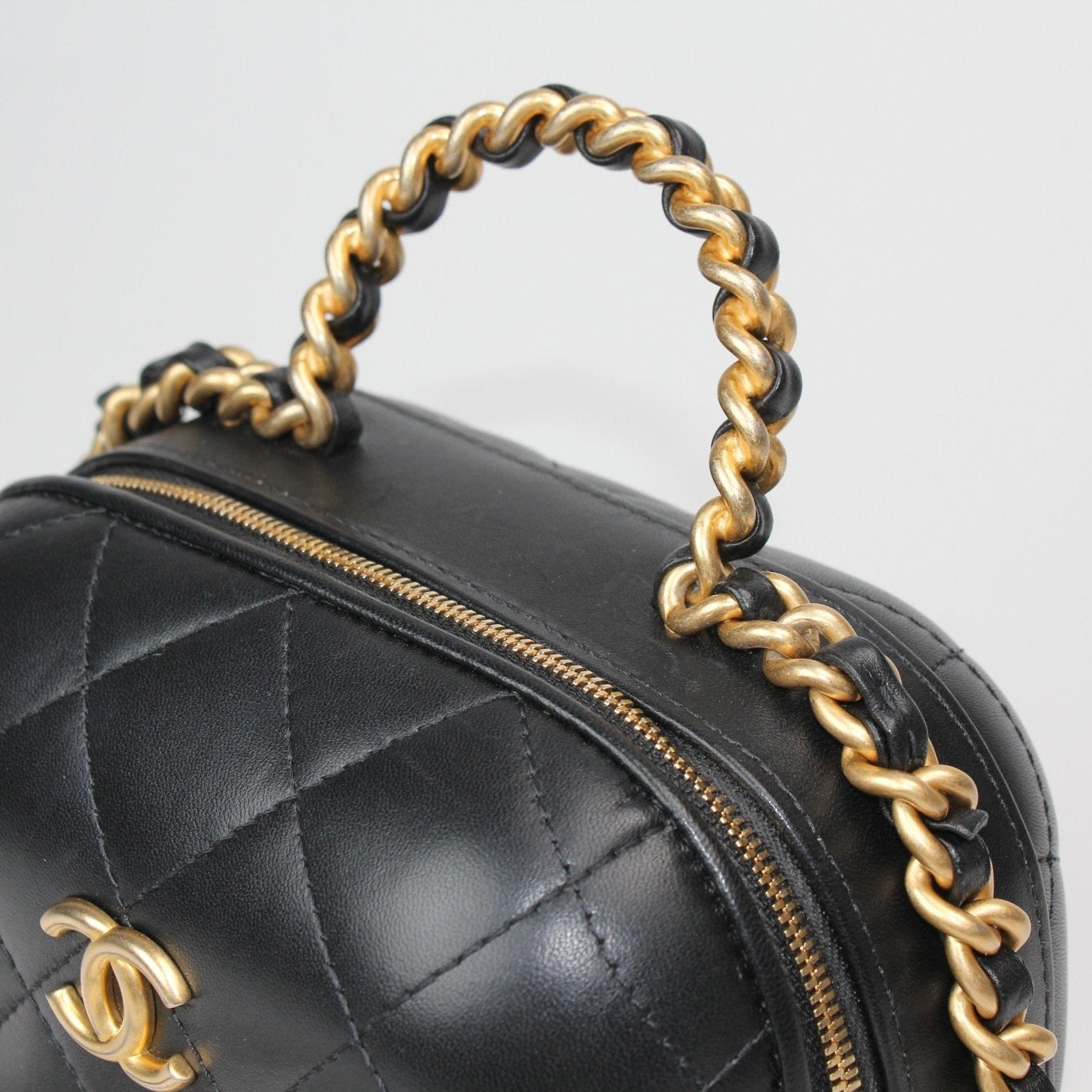 Chanel Matelassé Vanity Shoulder Bag in quilted black leather with gold-tone hardware and a stylish chain strap.