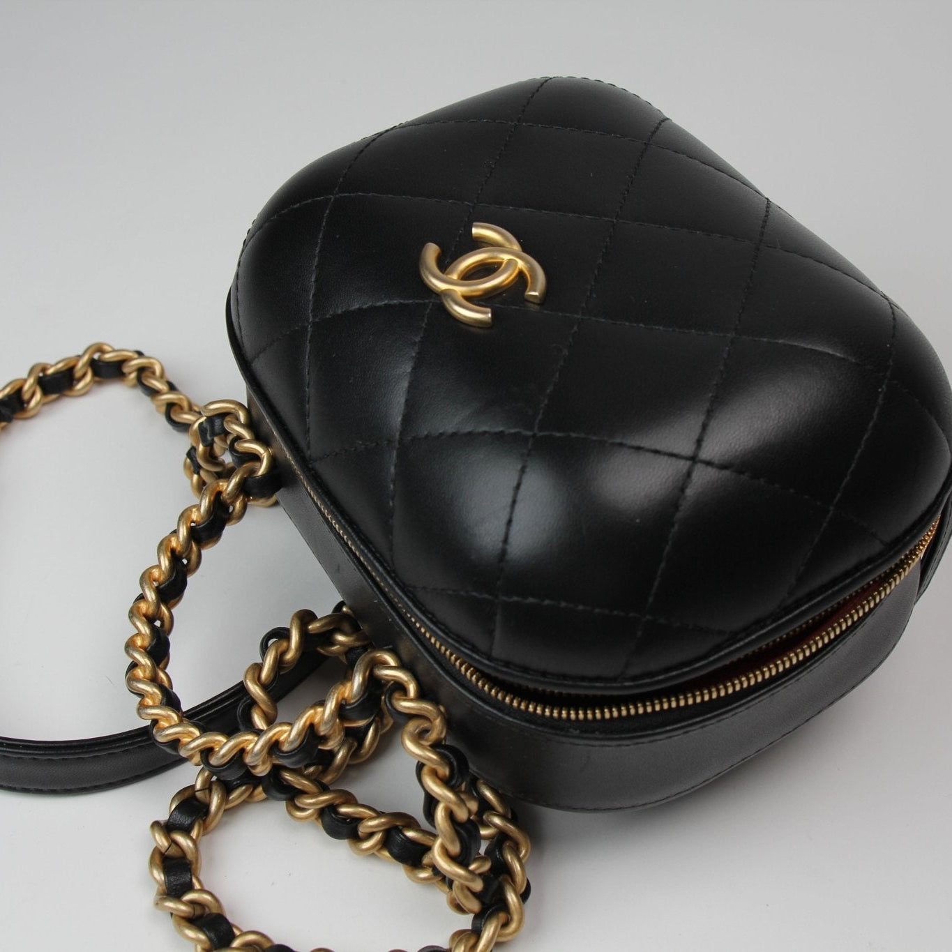 Chanel Matelassé Vanity Shoulder Bag in black leather with quilted design and gold-tone chain strap.